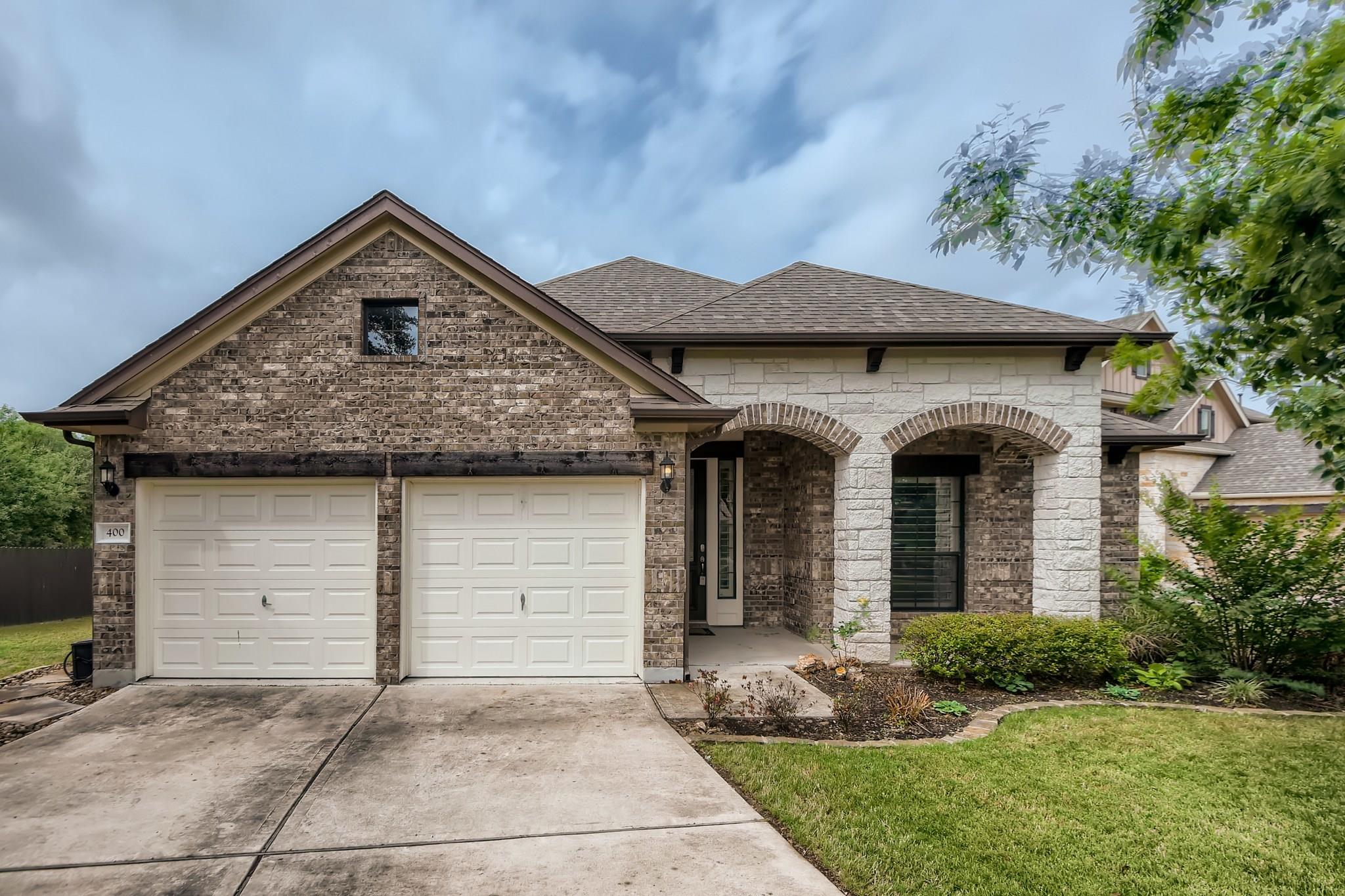 Textured brickwork, arched stone entryways, and a