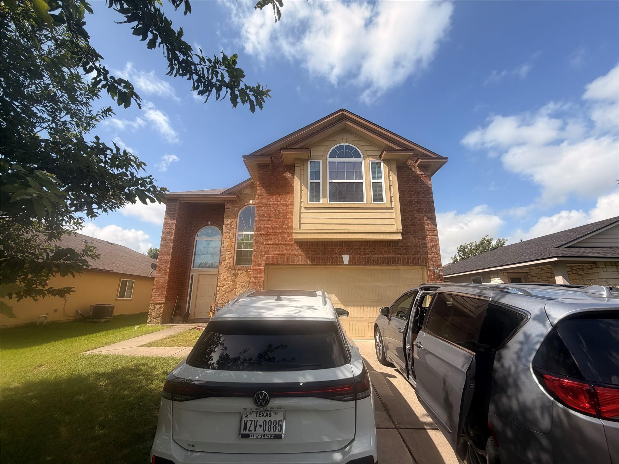 Brick siding and arched windows highlight the fac