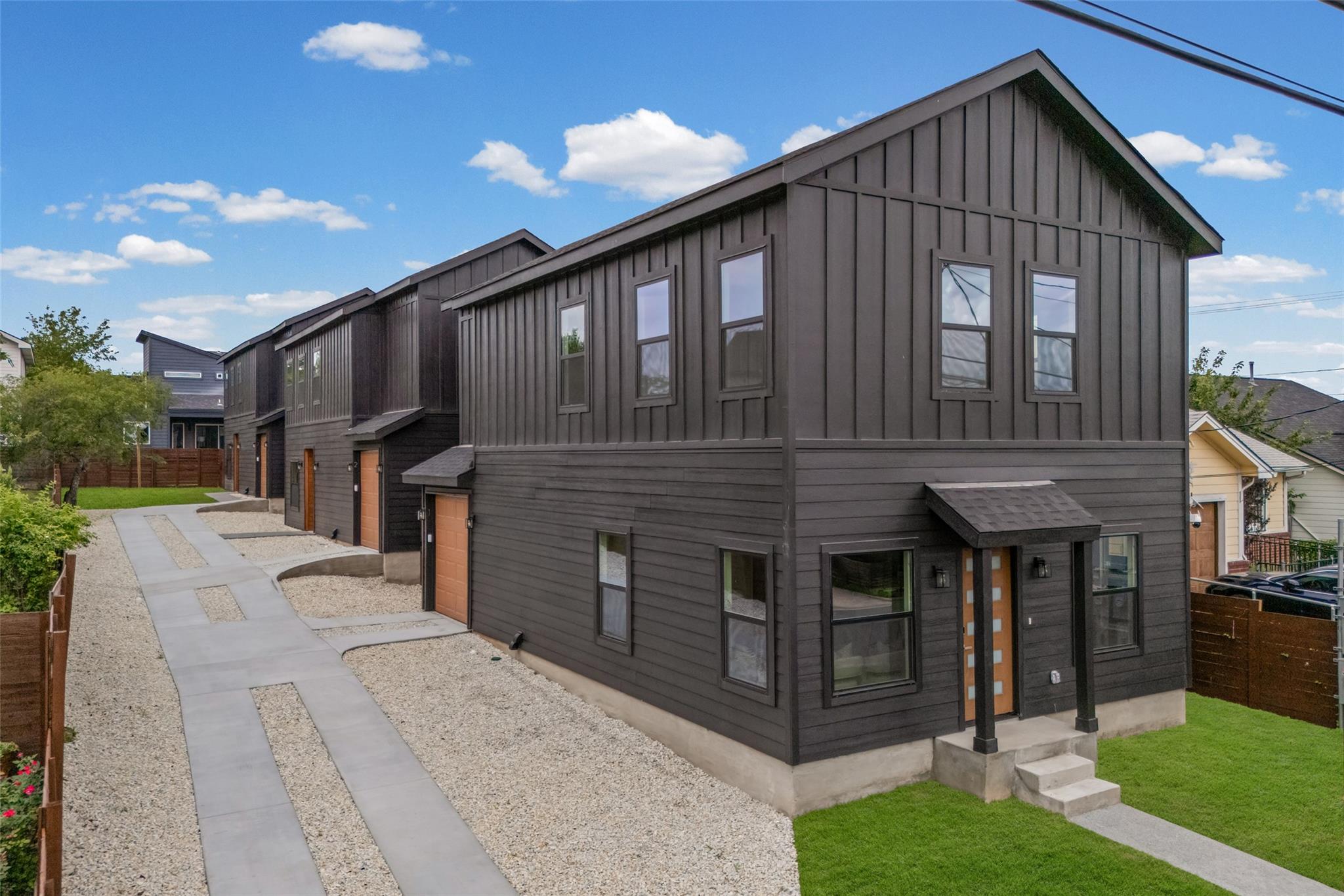 Bold vertical siding and sleek modern lines defin