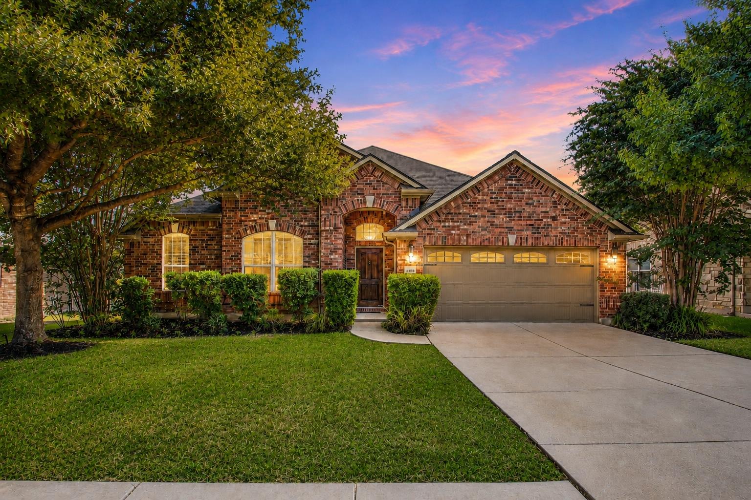 Classic brick elevation presents an arched entry,