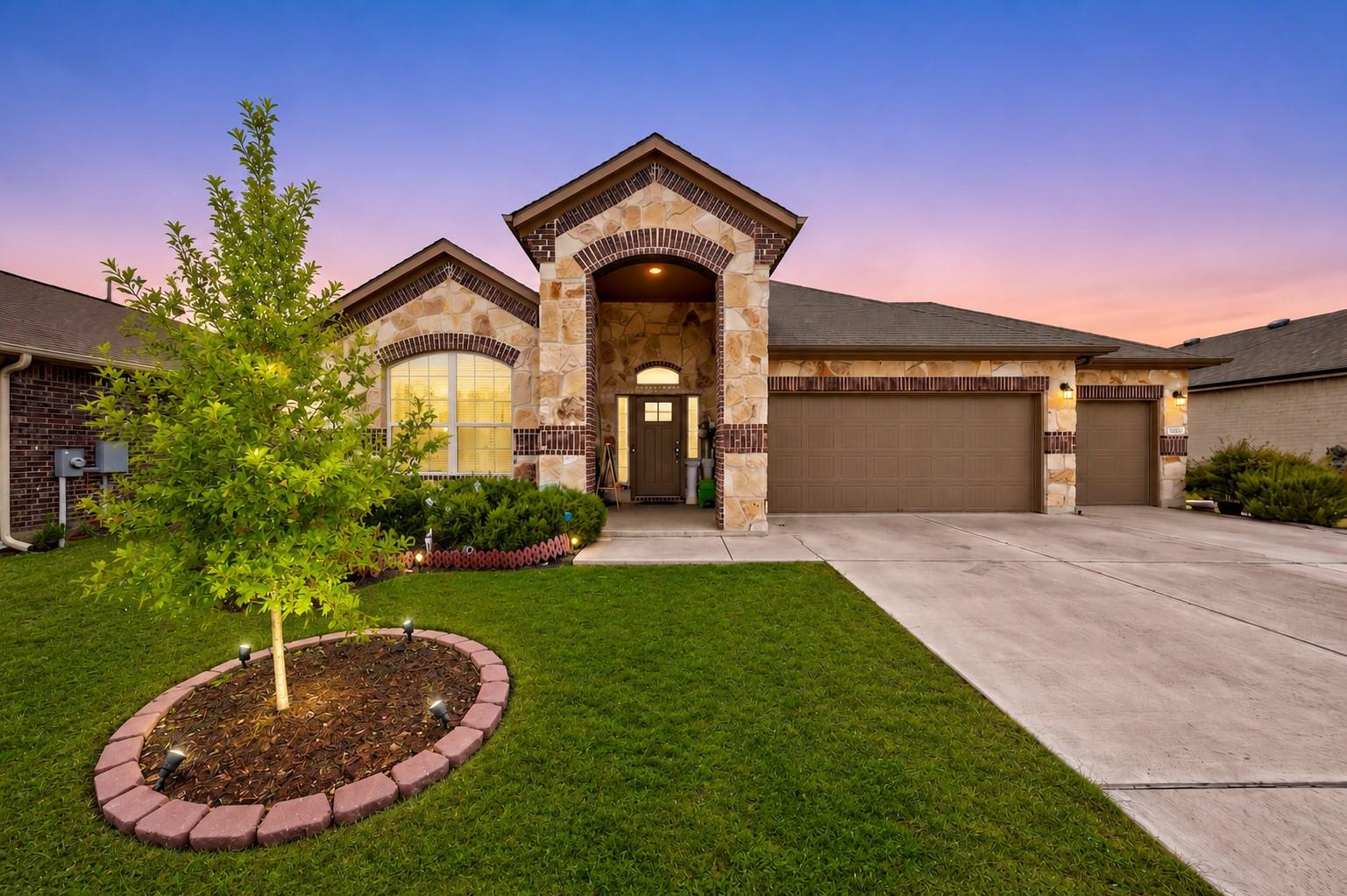 Striking stone and brick accents frame the entryw
