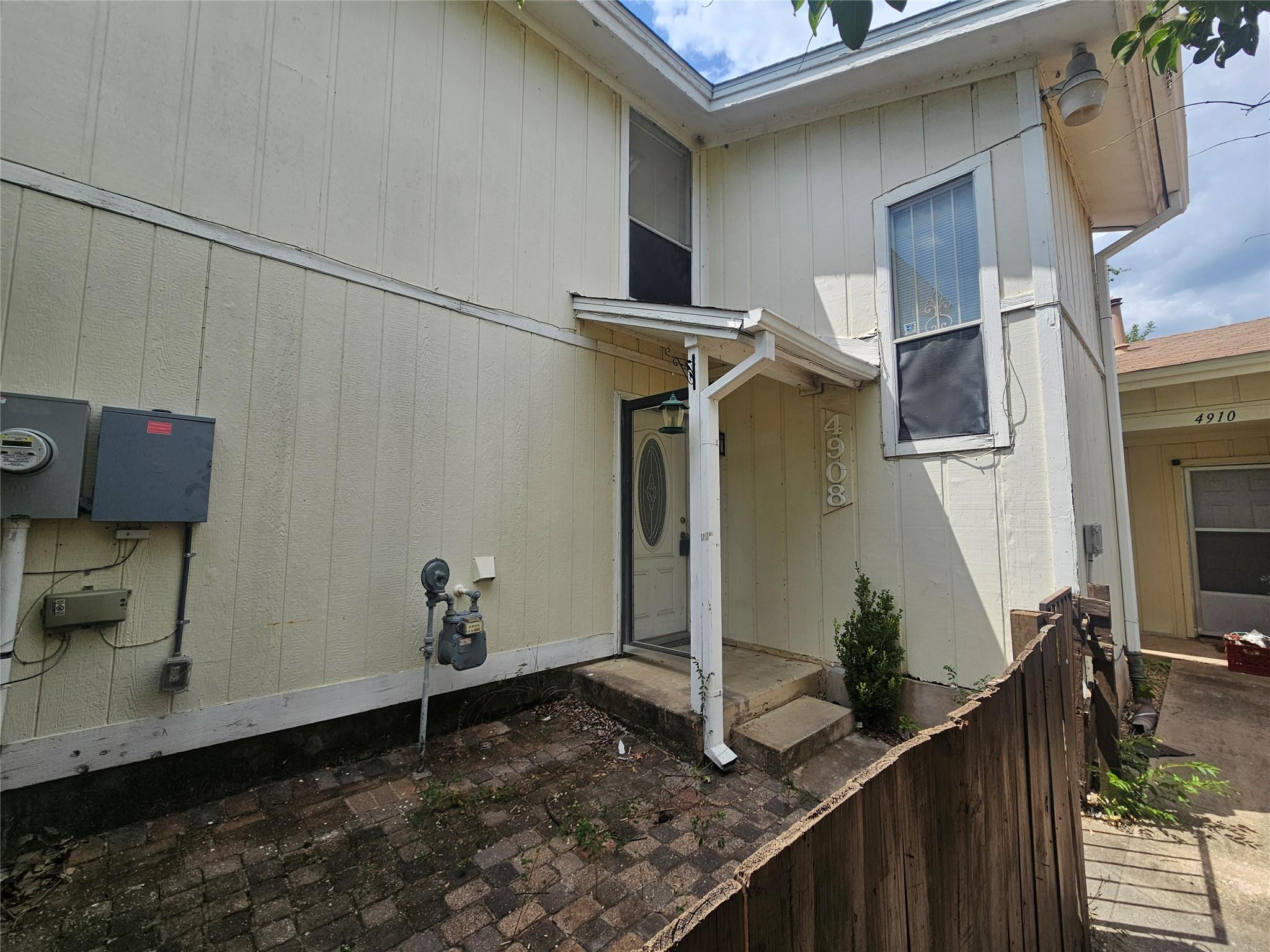 A sheltered entryway welcomes visitors to this cl