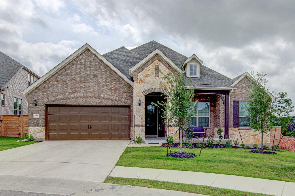 Multi-textured brick and stone masonry defines th