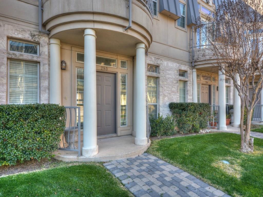 Classical columns frame a welcoming, covered entr
