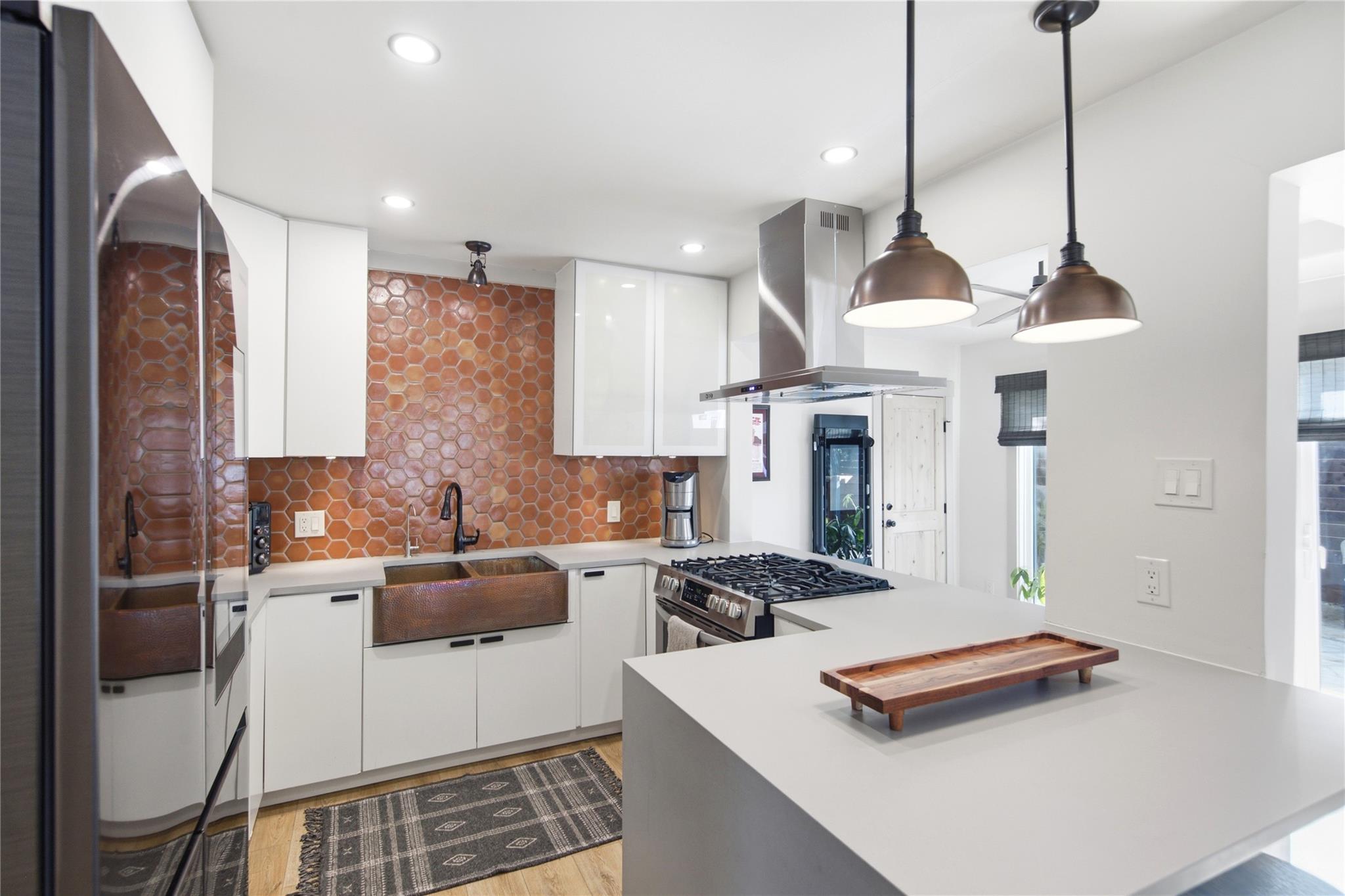 Modern cabinetry meets a textured tile backsplash