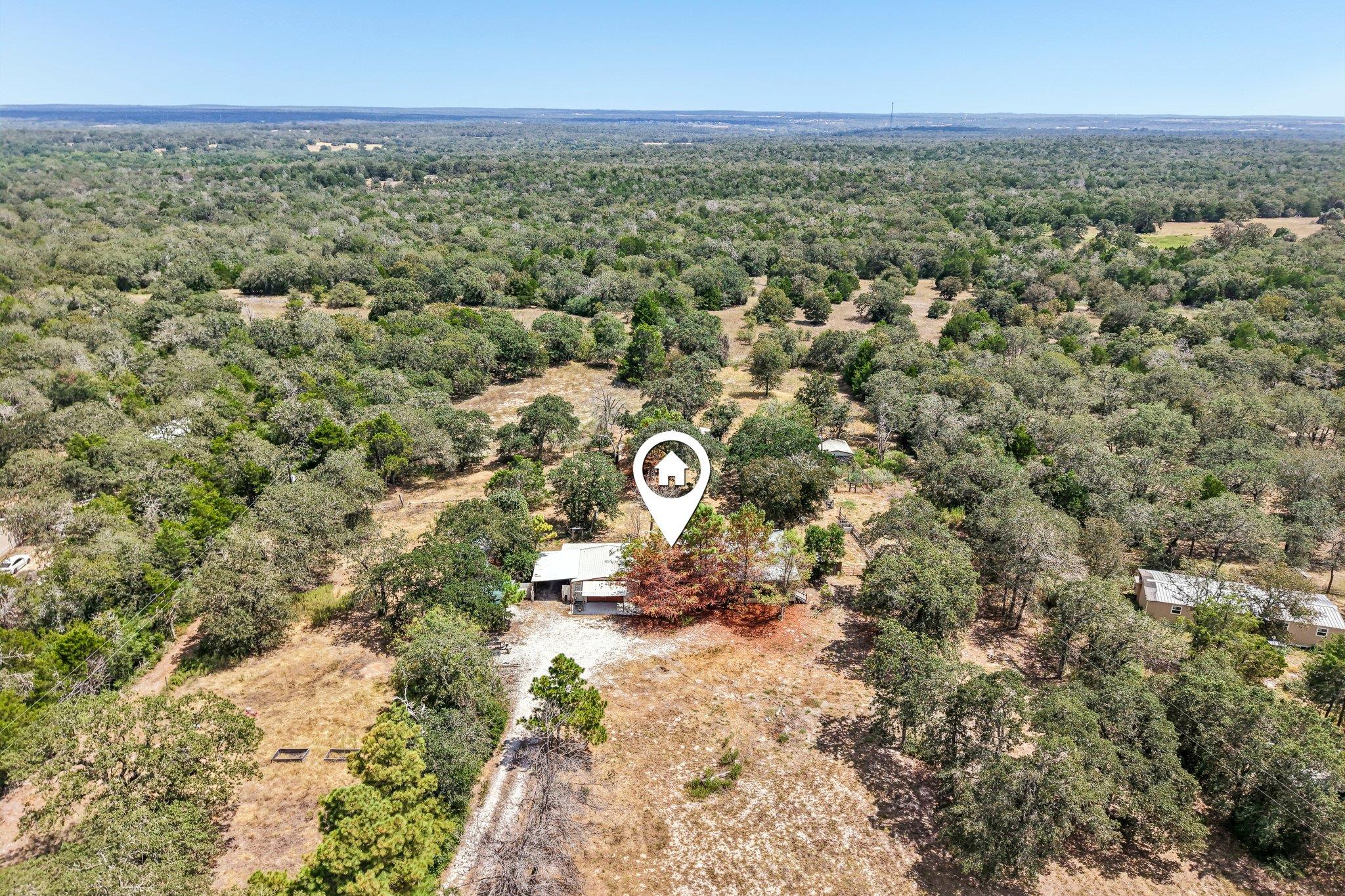 Mature woodlands envelope this expansive country 