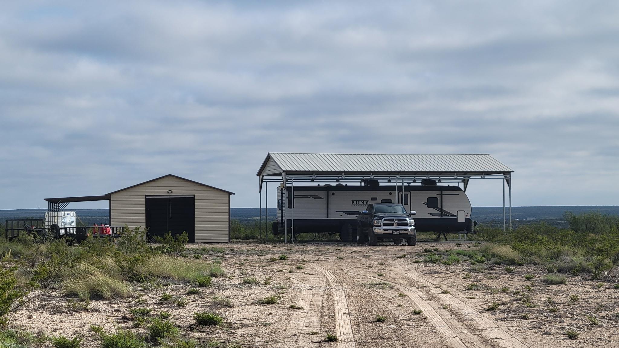 A spacious lot features a metal storage building 