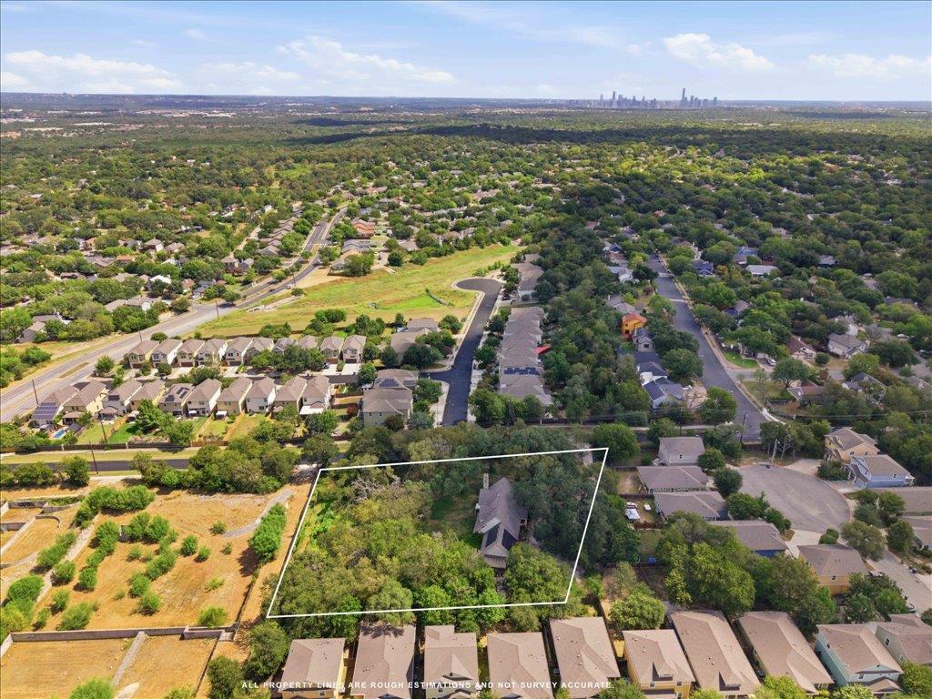 Aerial perspective reveals a private wooded lot w