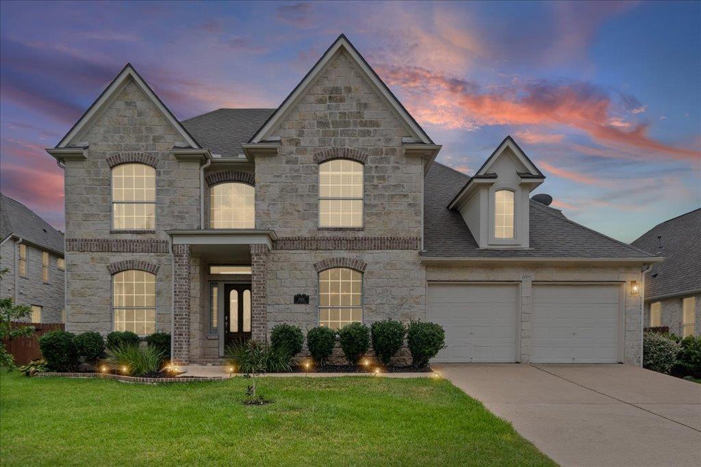 Grand stone masonry highlights this multi-level f