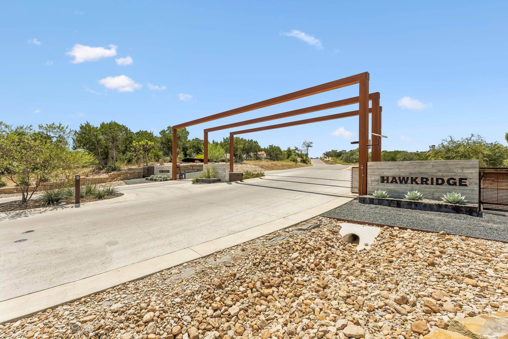 A secure, gated entry leads to the neighborhood o