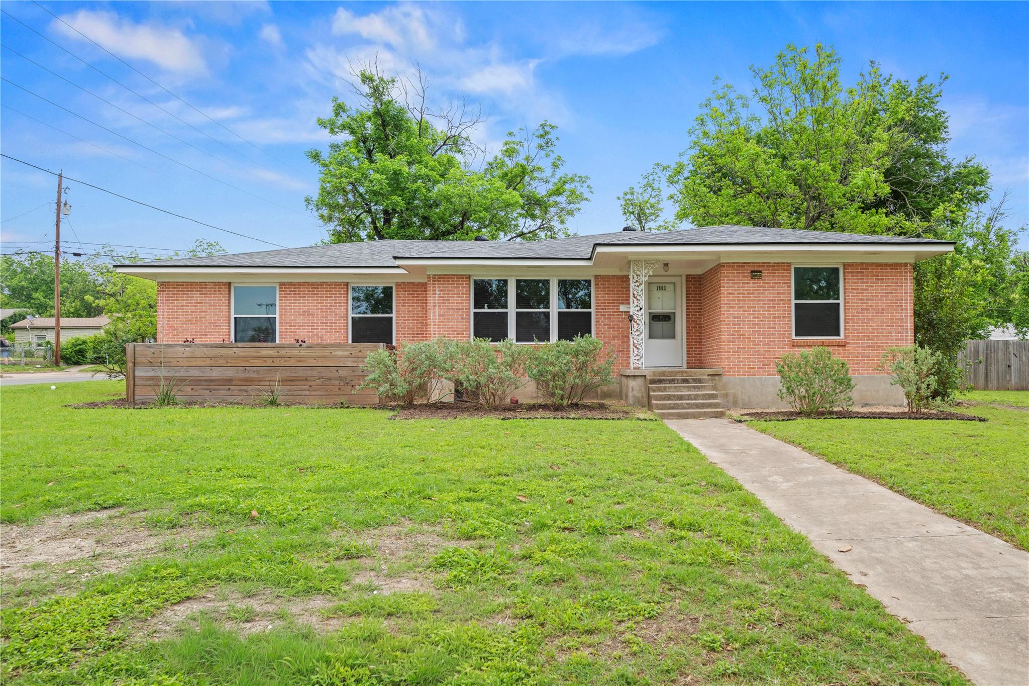 Classical brick architecture anchors this single-