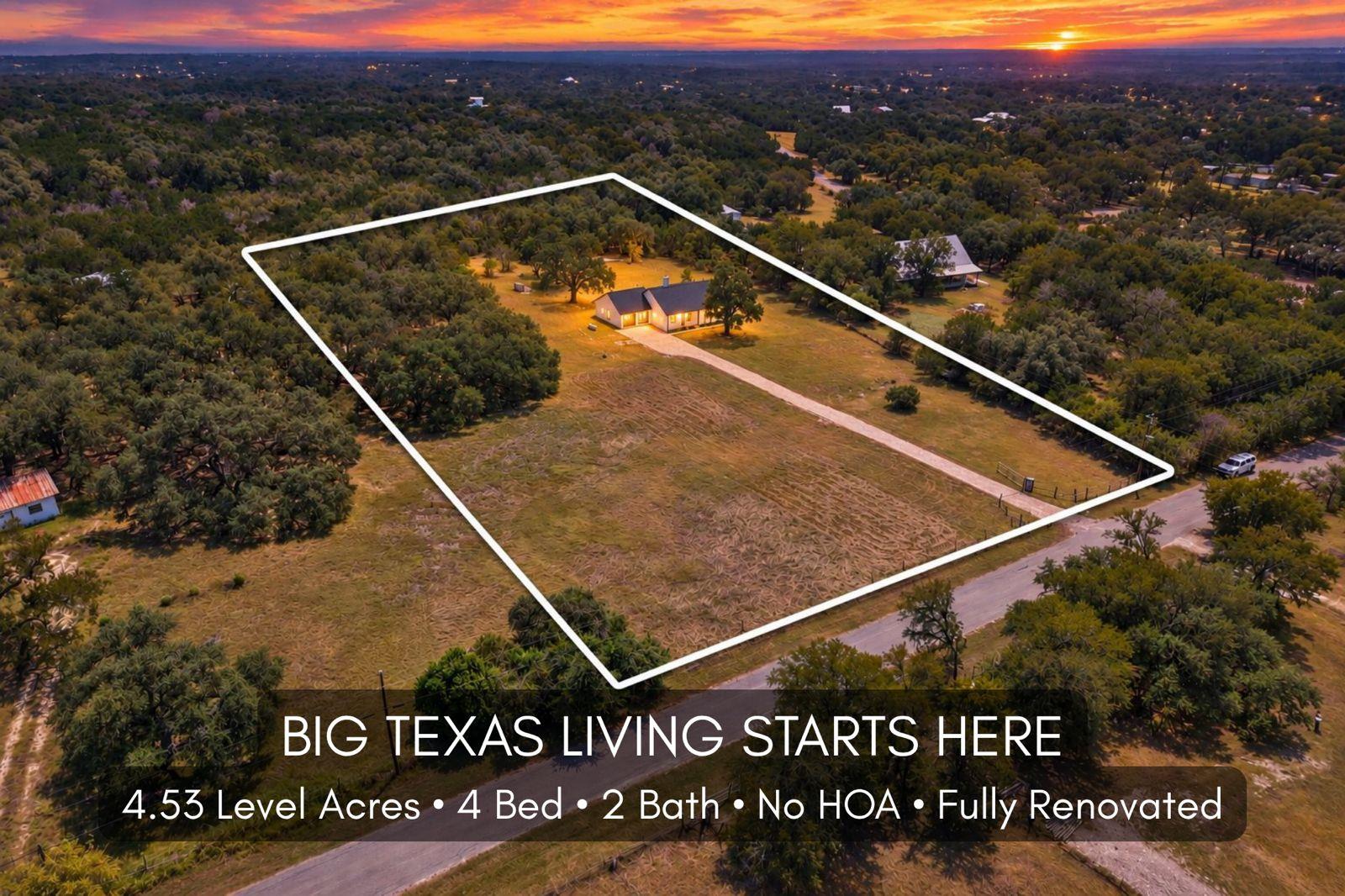 An expansive wooded property spreads beneath a dr