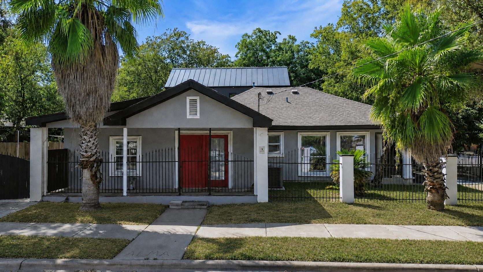 Palm trees frame a classic exterior showcasing st