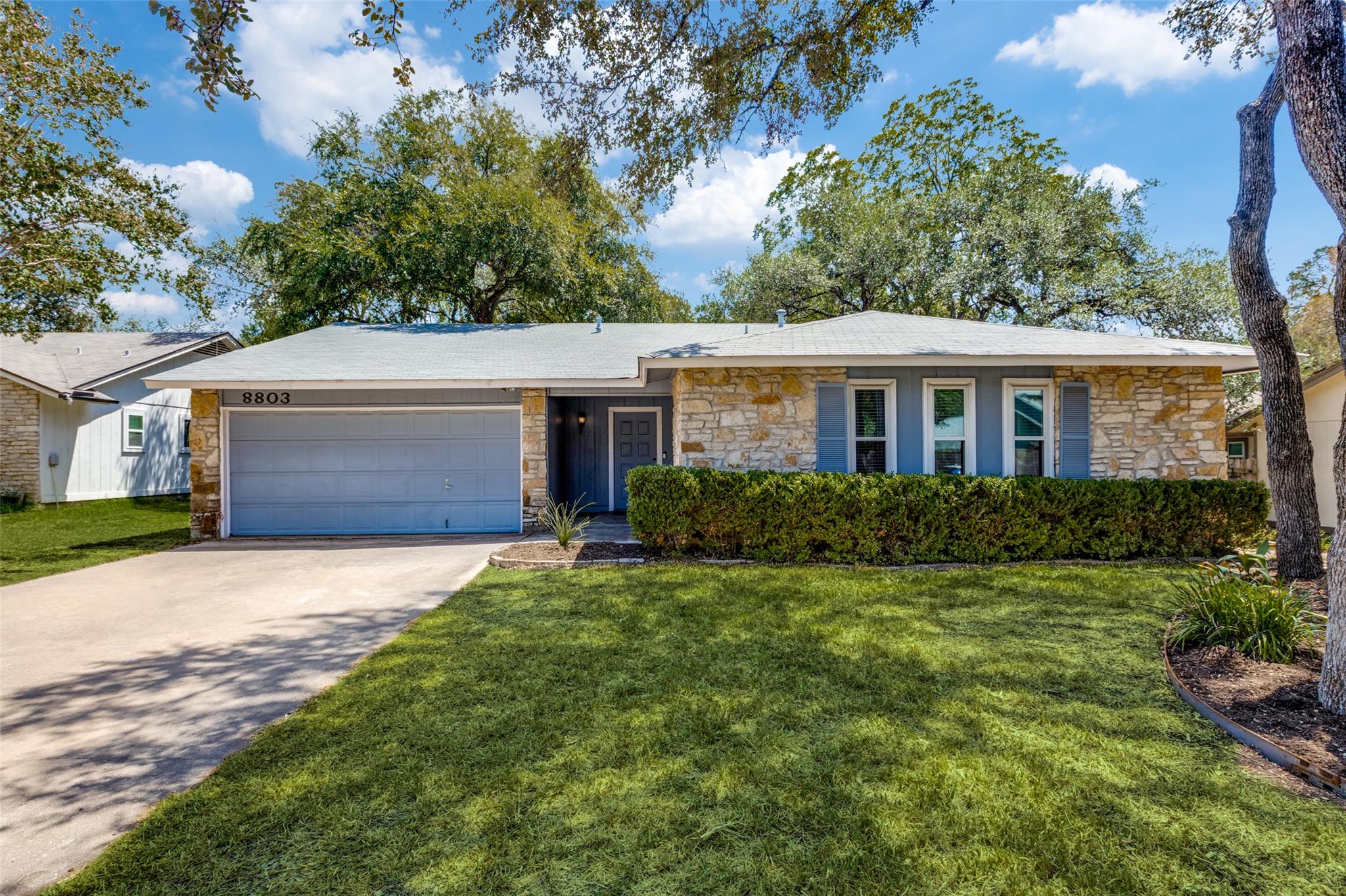 Mid-century style shines through stone siding and