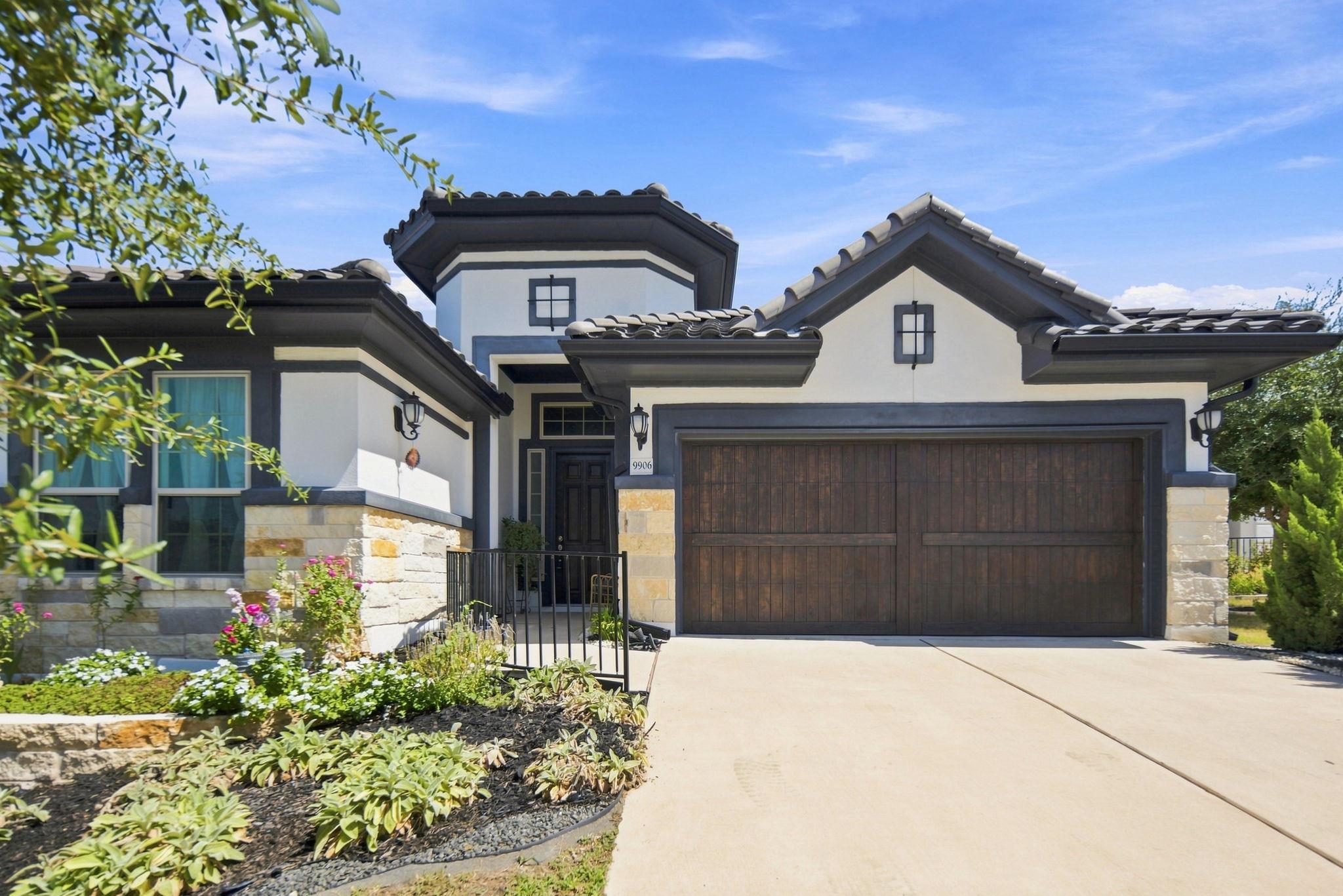 Crisp masonry lines and a tile roof define the fa