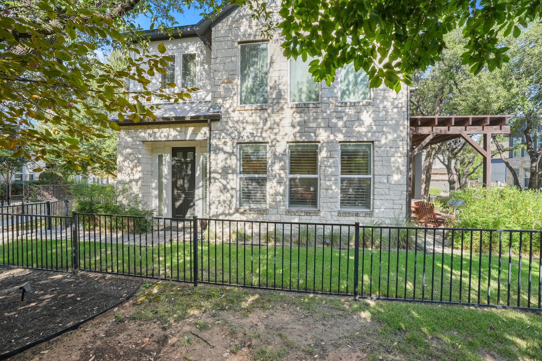 Textured light stone masonry defines the stately 