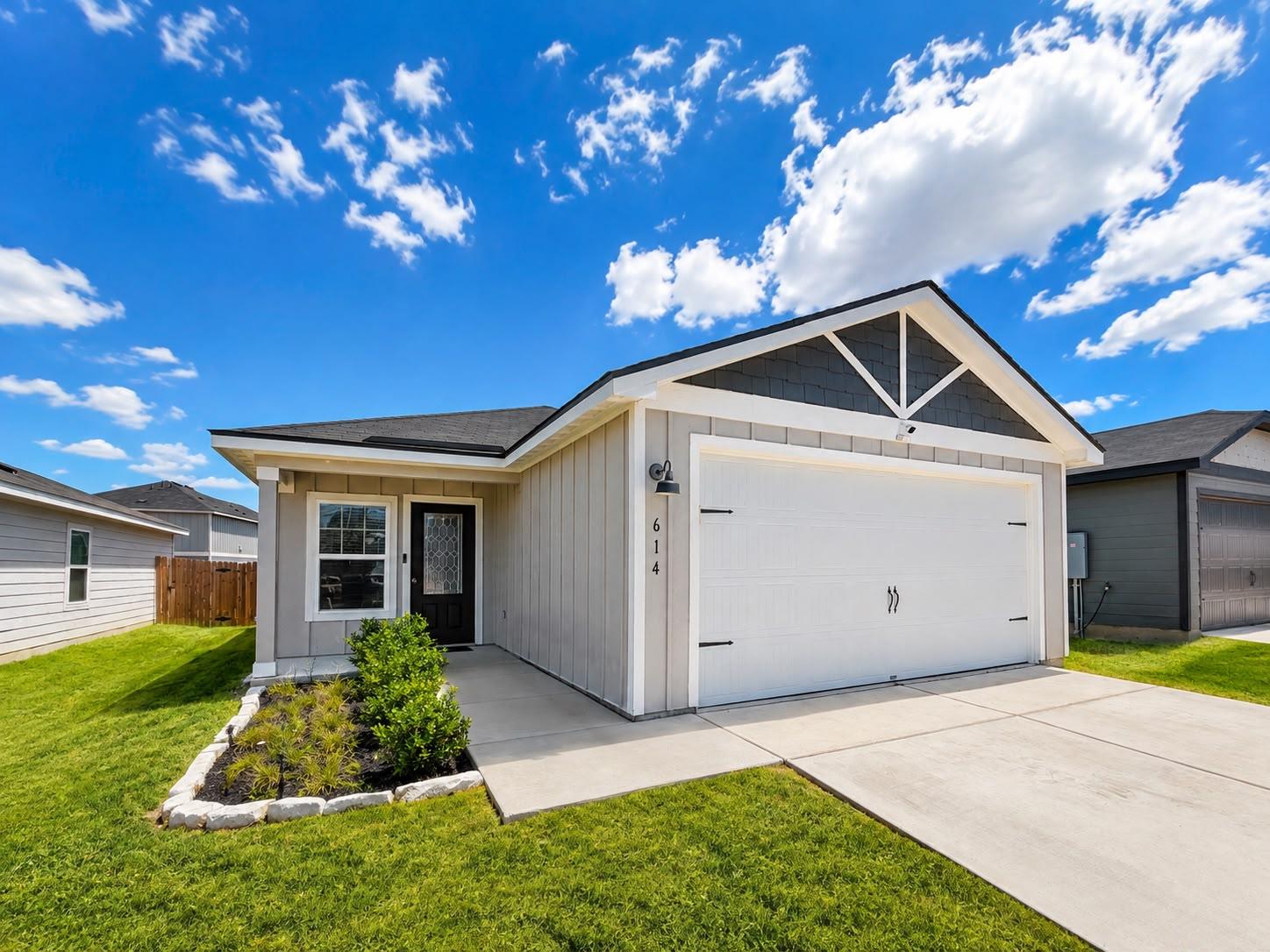 Board and batten siding pairs with a neat concret