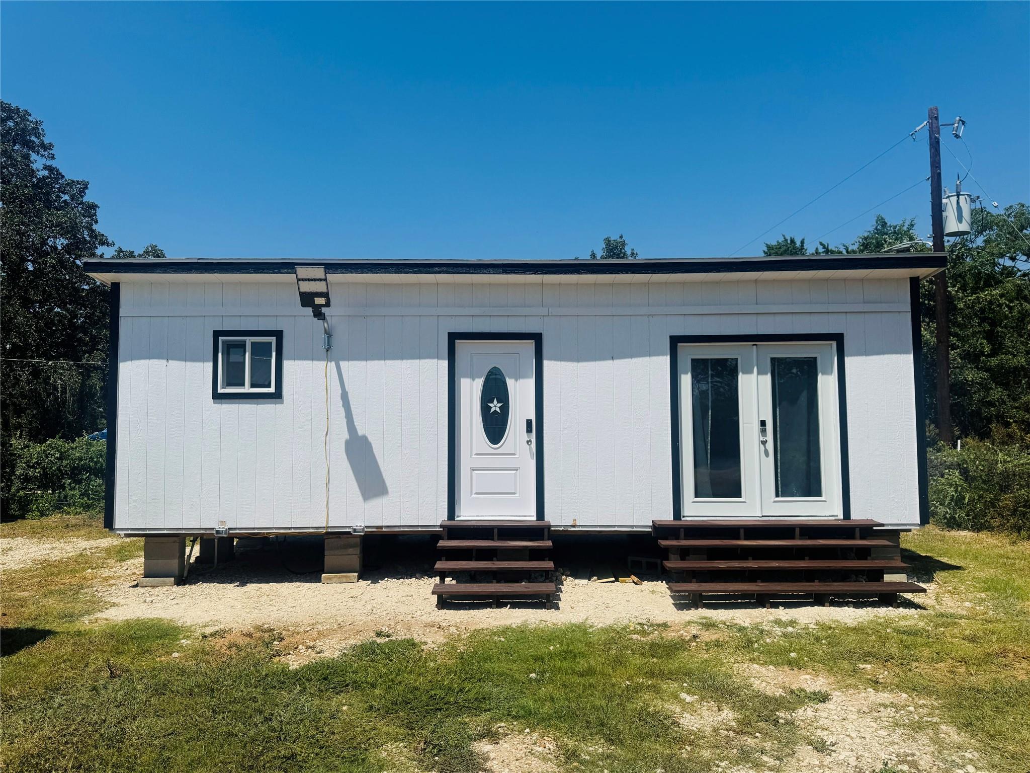 Board and batten siding pairs with French doors o