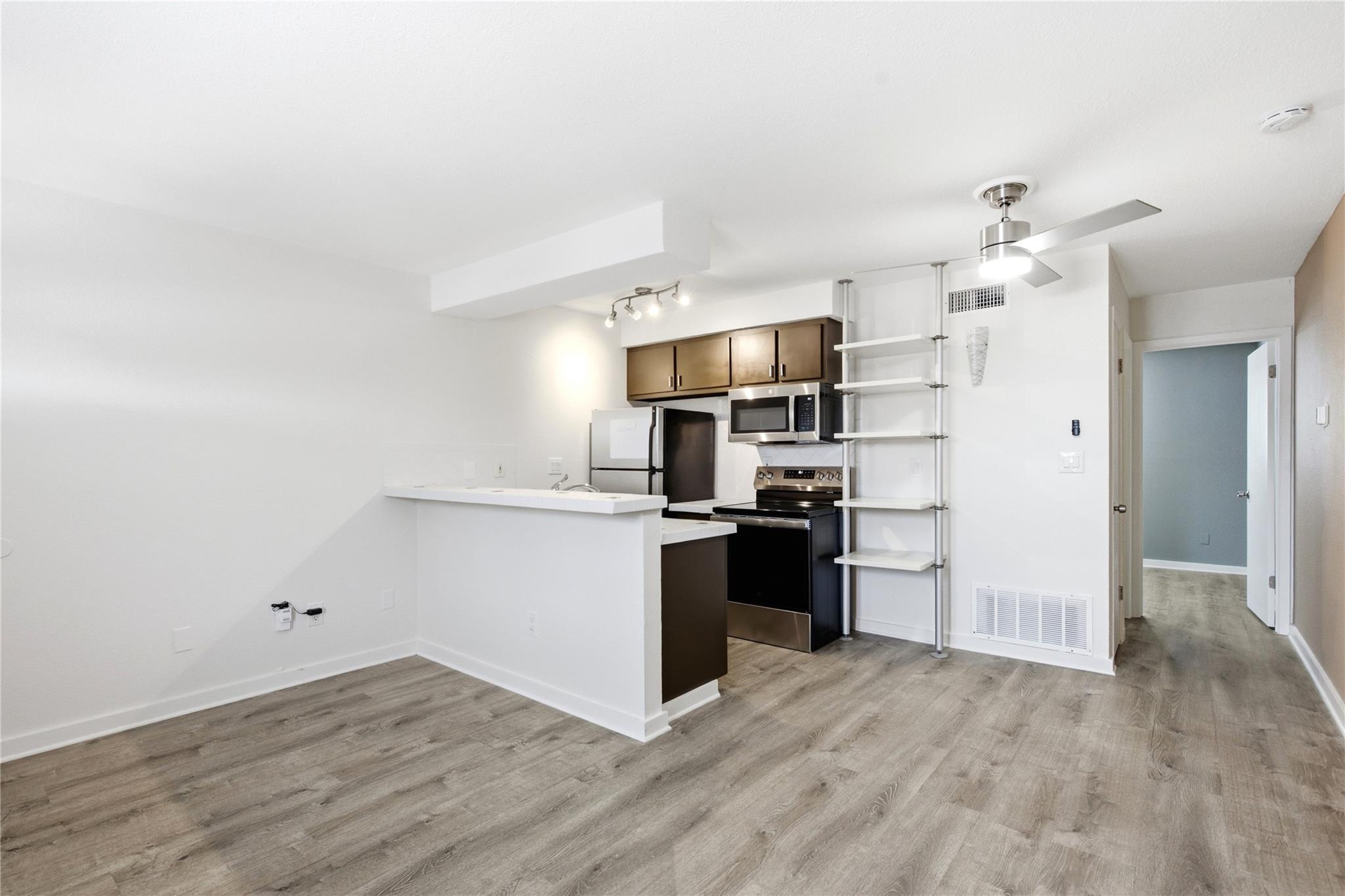 Smooth wood-look flooring anchors a modern culina