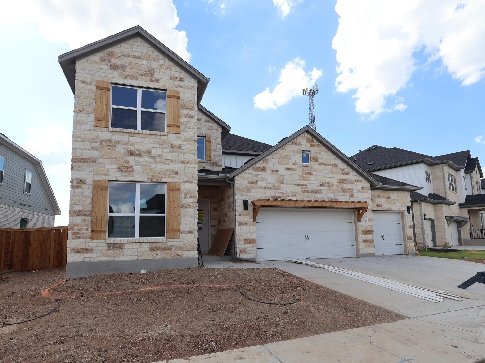 A stone facade and wooden shutters define the ext