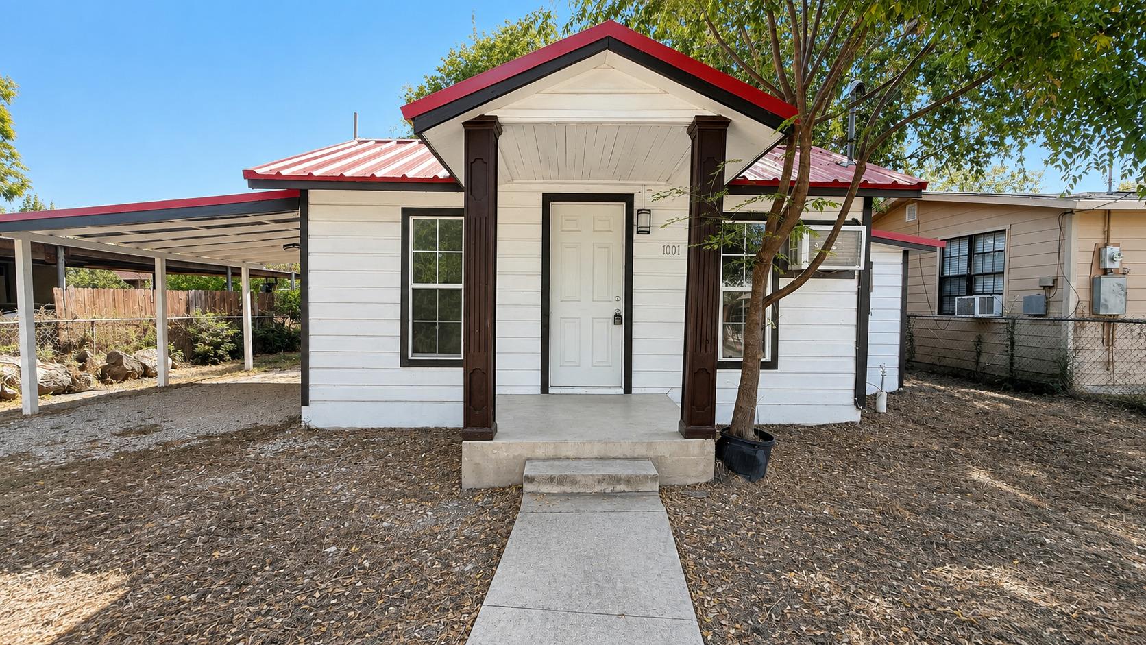 Classic horizontal siding and a red metal roof de