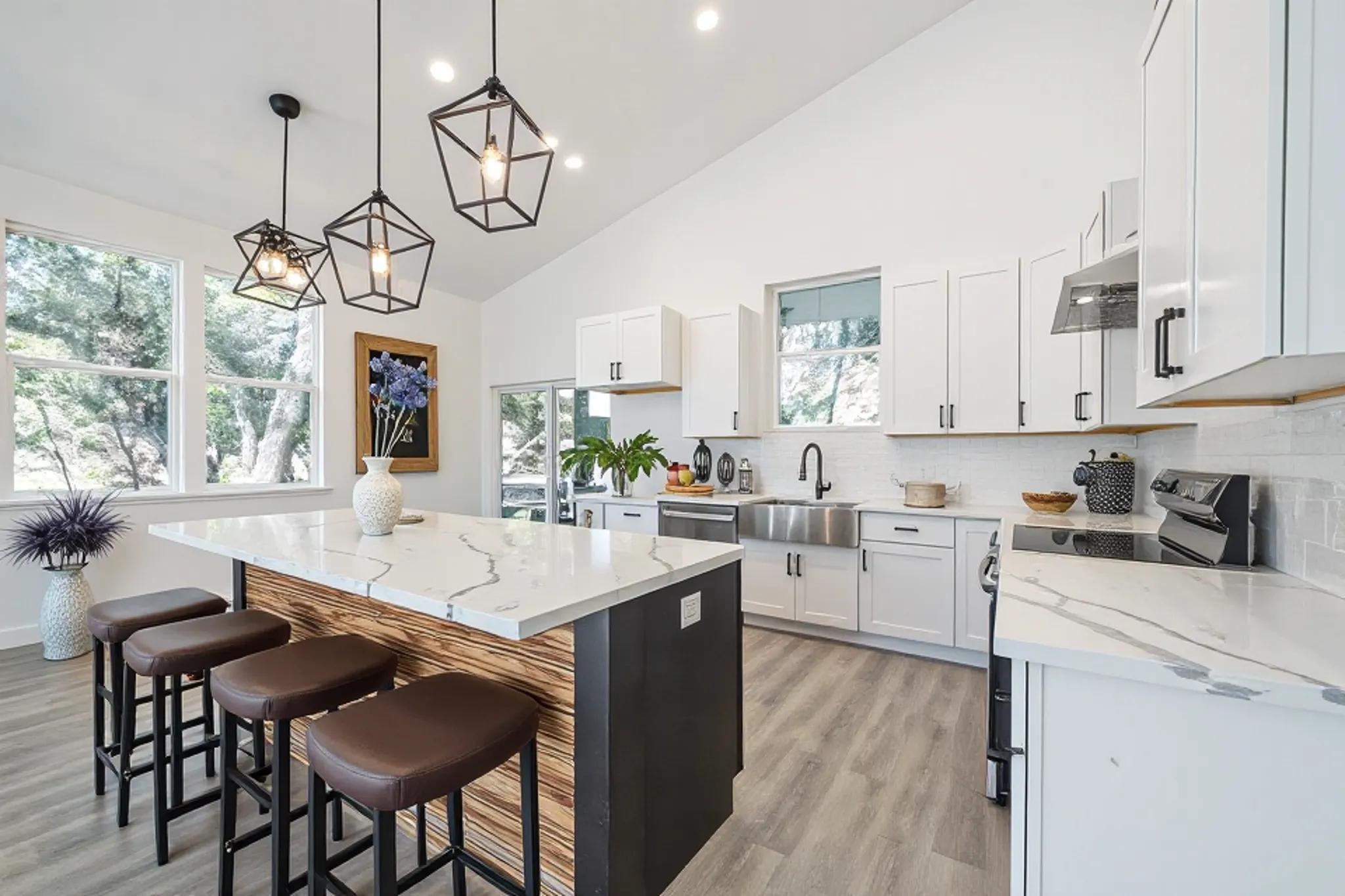 Soaring ceilings and a generous island anchor thi
