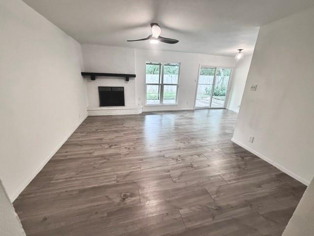 Smooth wood-look flooring anchors this open livin