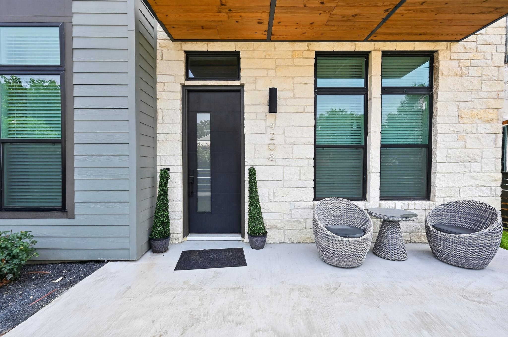 Natural stone masonry and warm wood ceiling accen