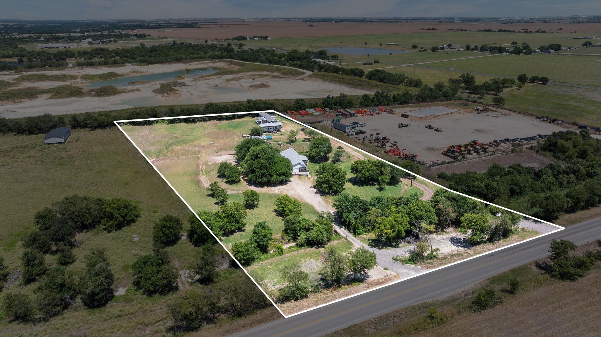 Aerial view outlines the generous property acreag