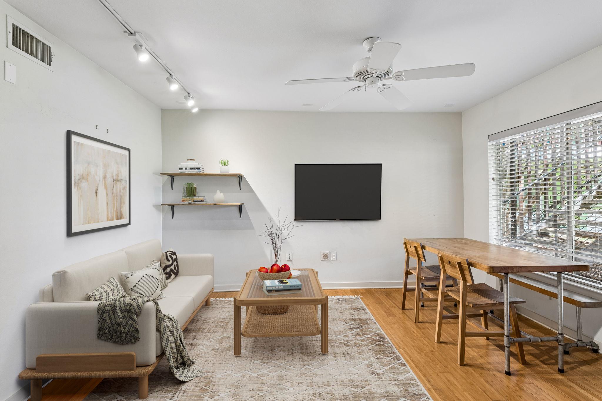 Gleaming hardwood floors and a broad window creat