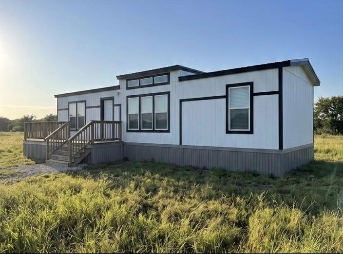 Clean lines and a raised wooden deck define this 