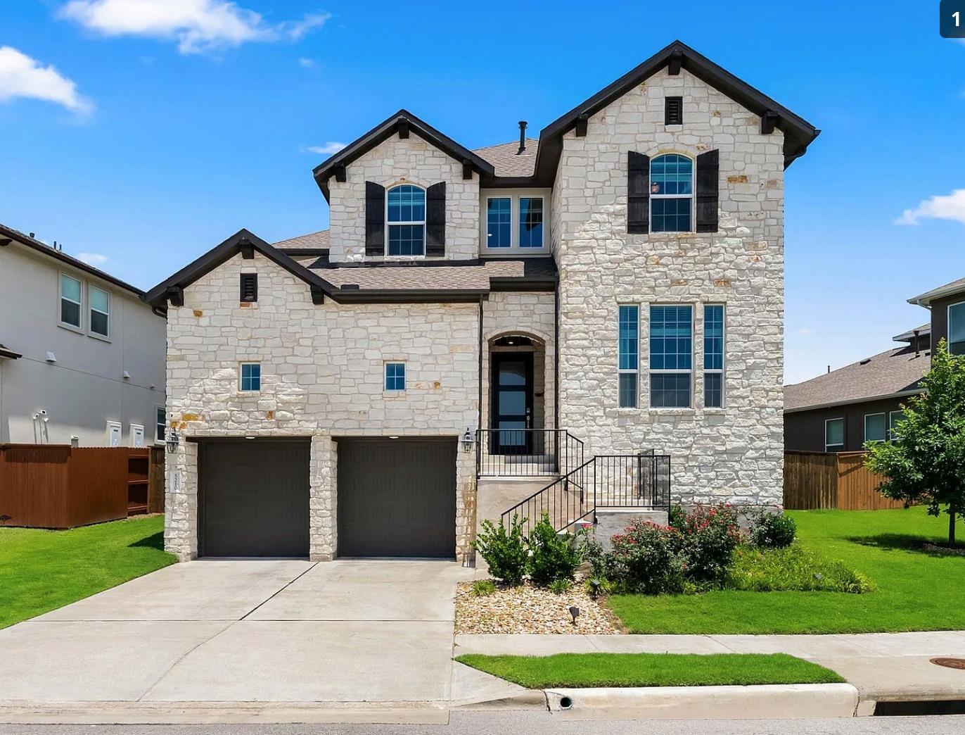 Textured light stone masonry defines this strikin