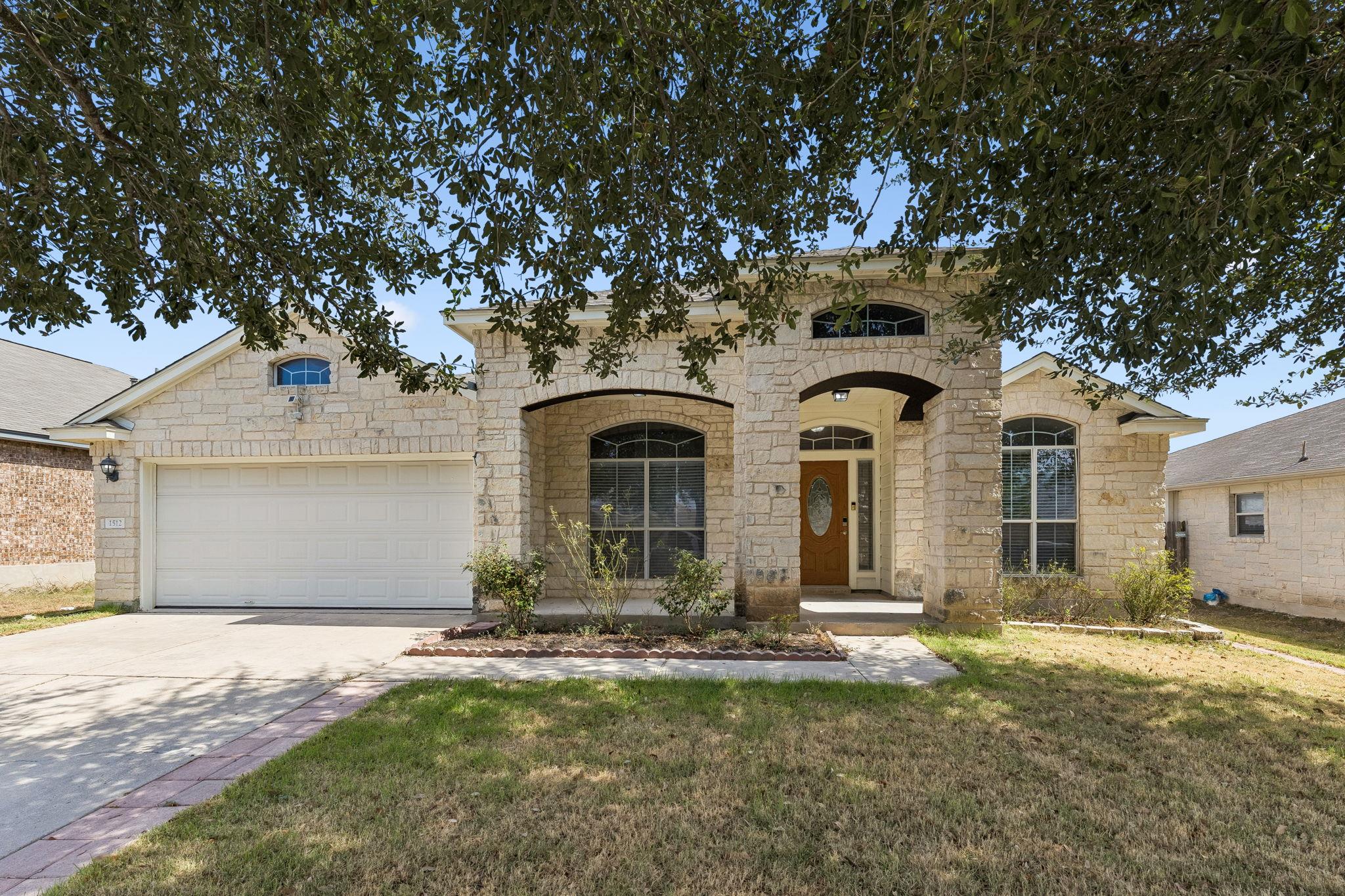 A classic stone exterior and arched entry design 