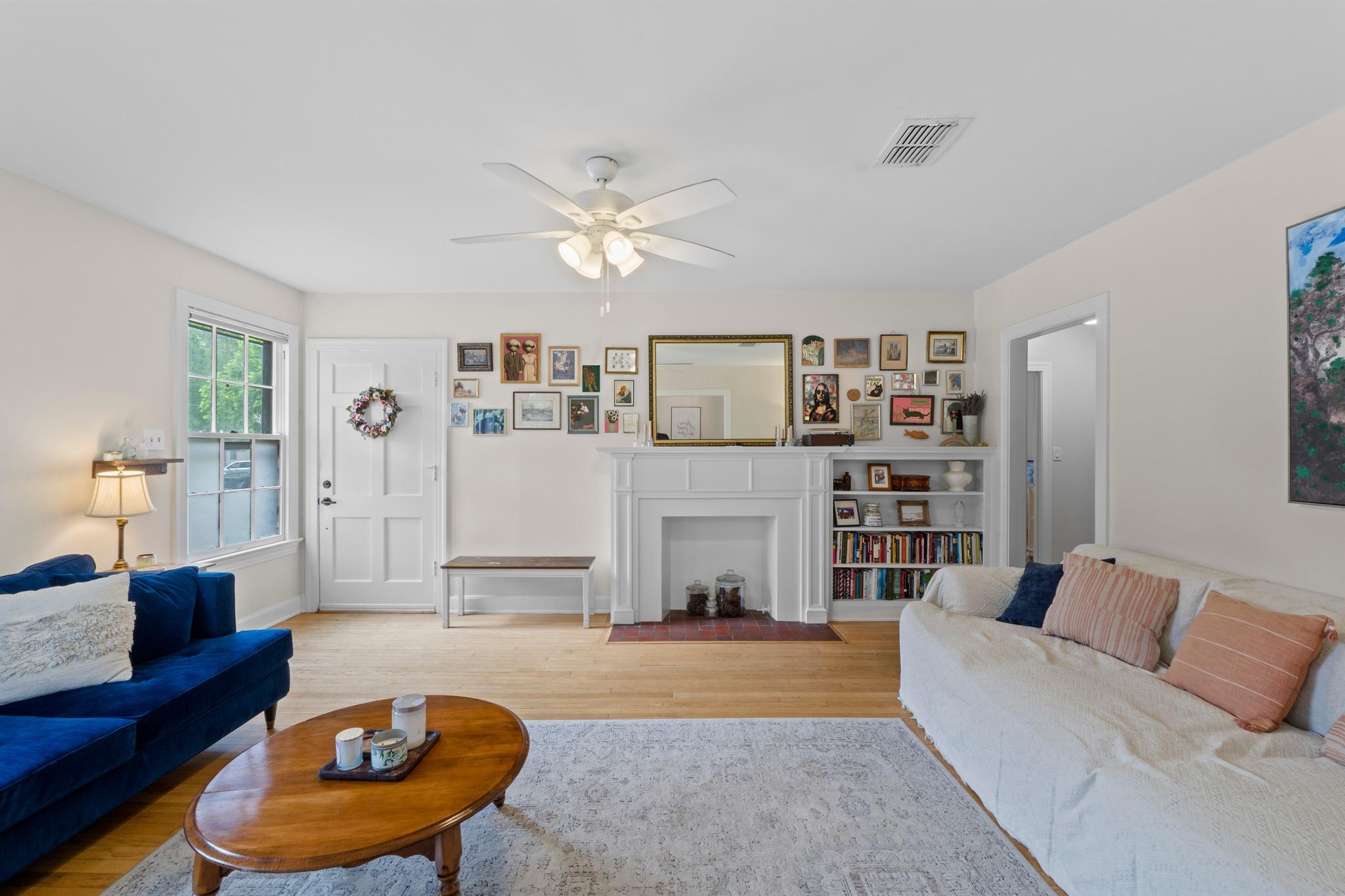 An inviting hearth centers this classic living sp