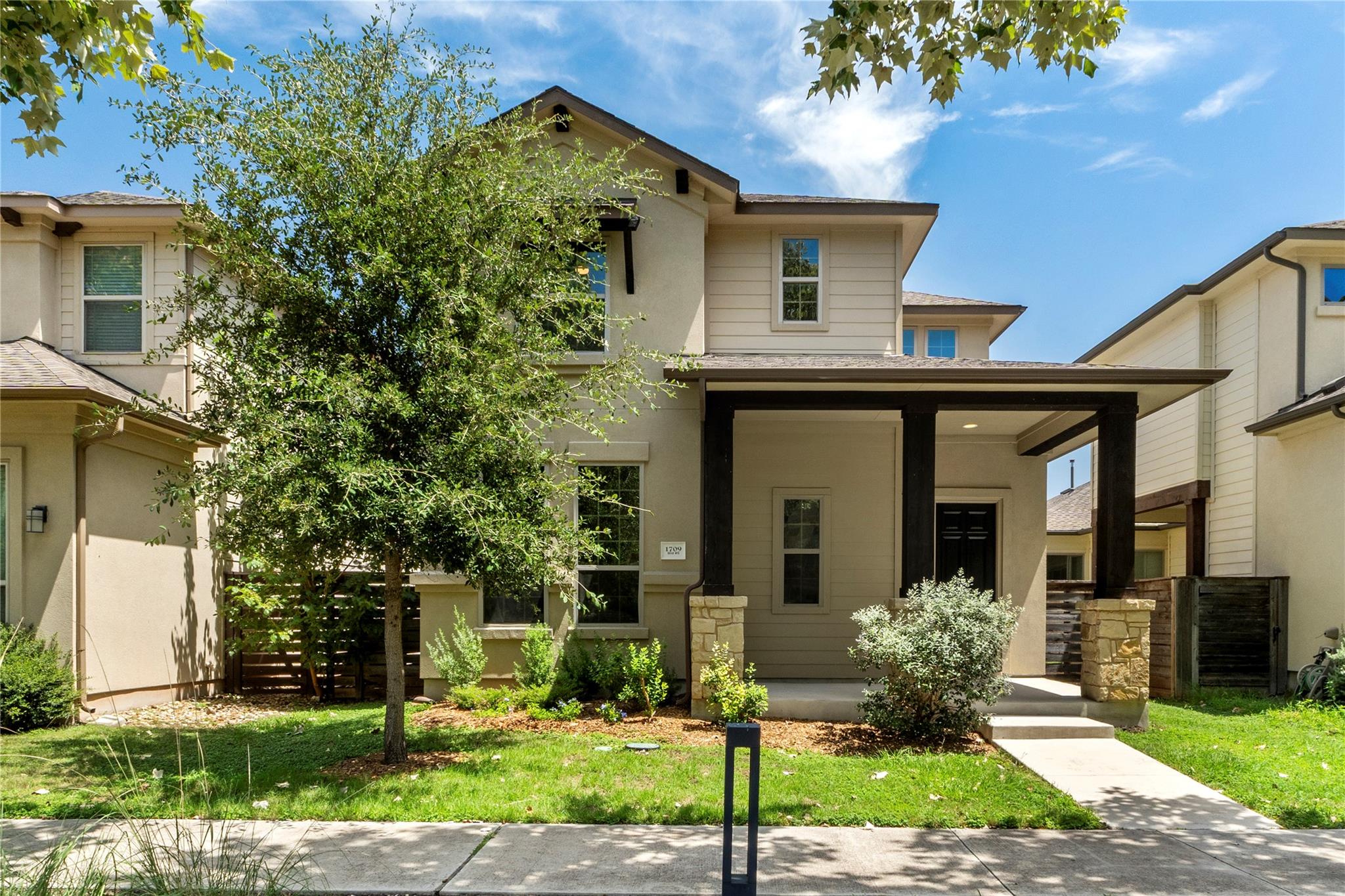 An inviting covered front porch sets a welcoming 