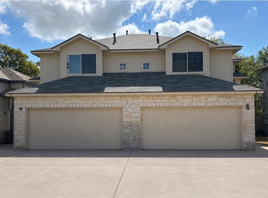 Limestone and siding accents define the exterior 