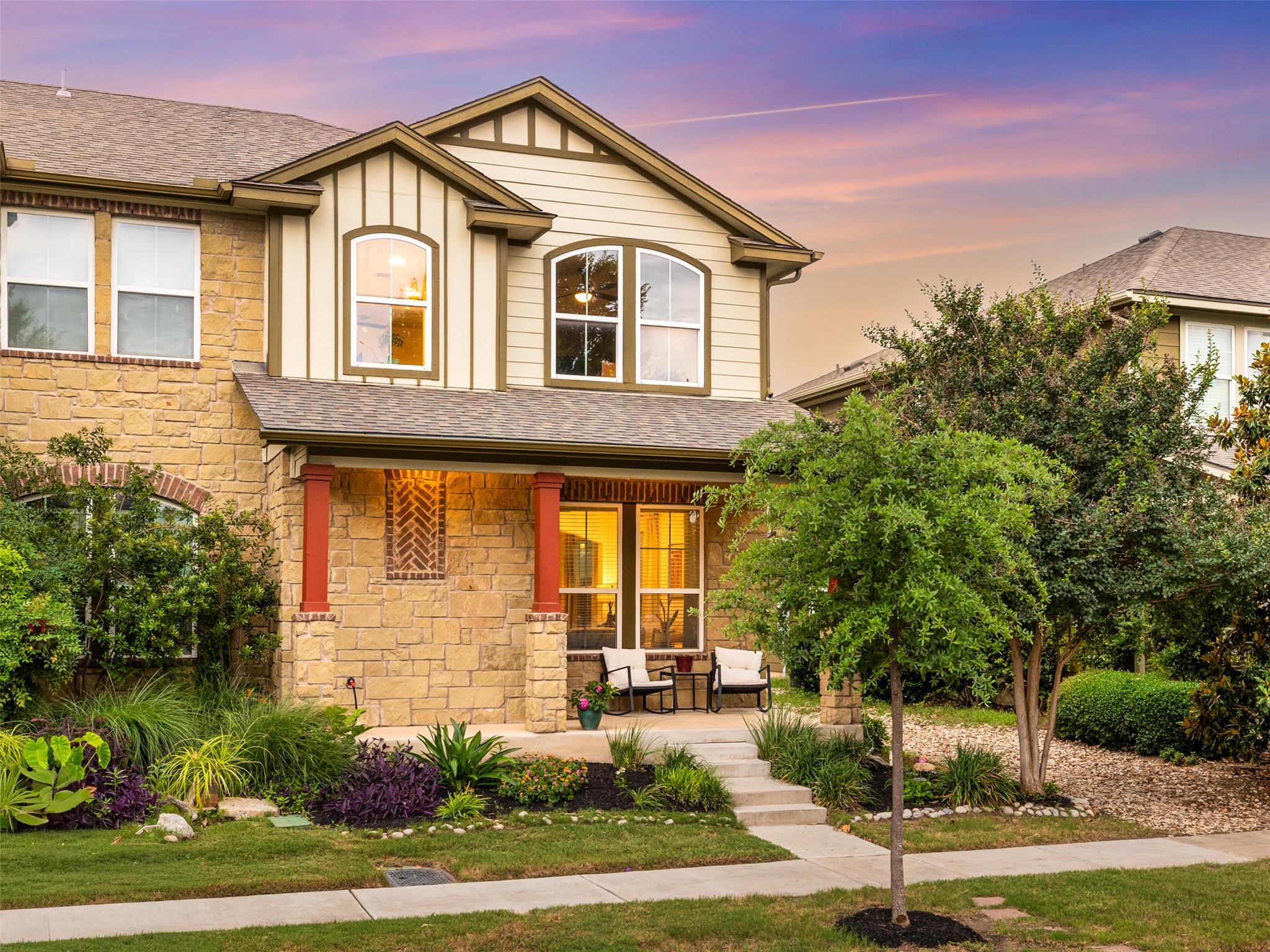 Natural stone masonry and gabled rooflines create