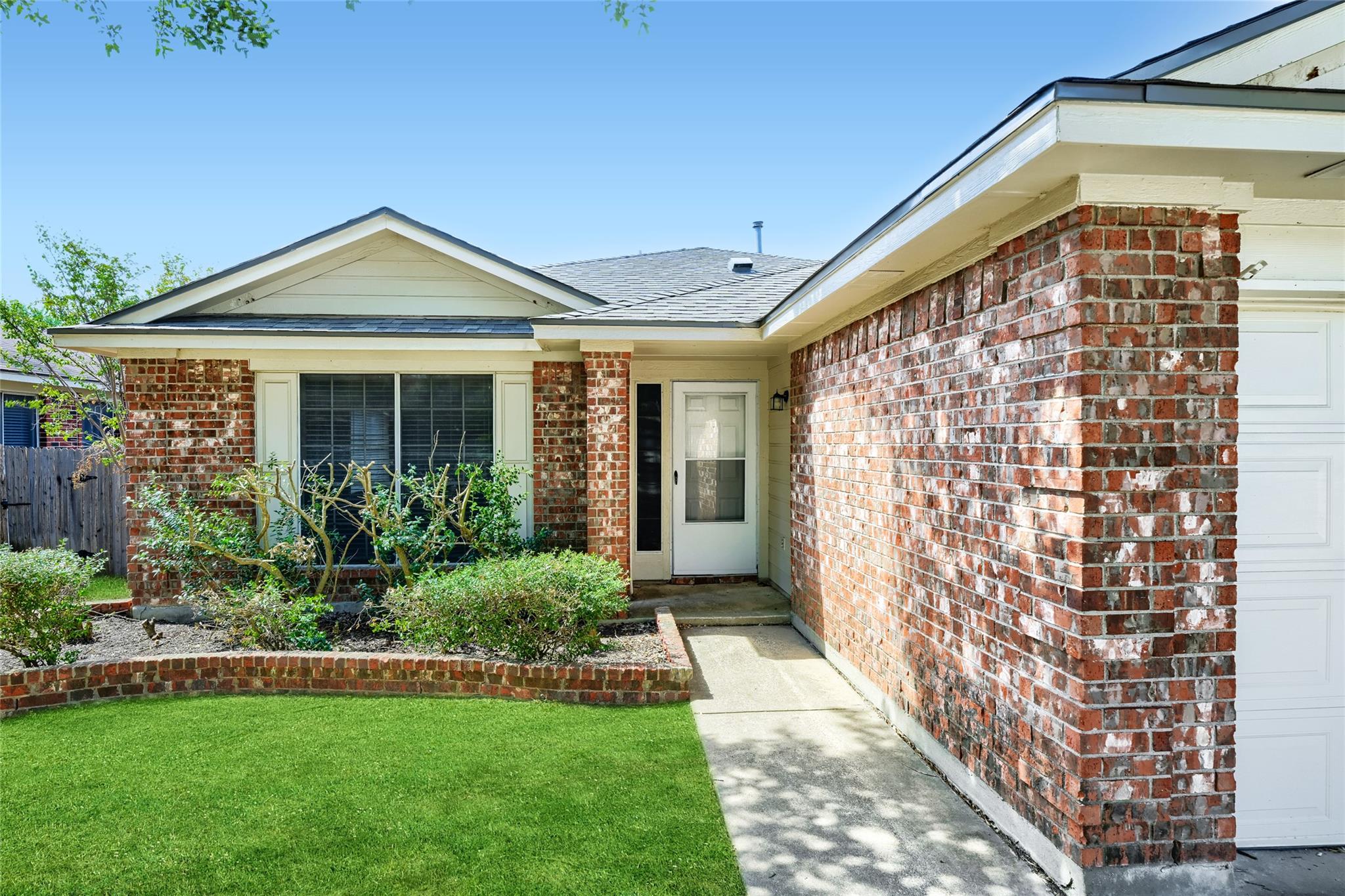 Classic brick exterior accents the front entry of