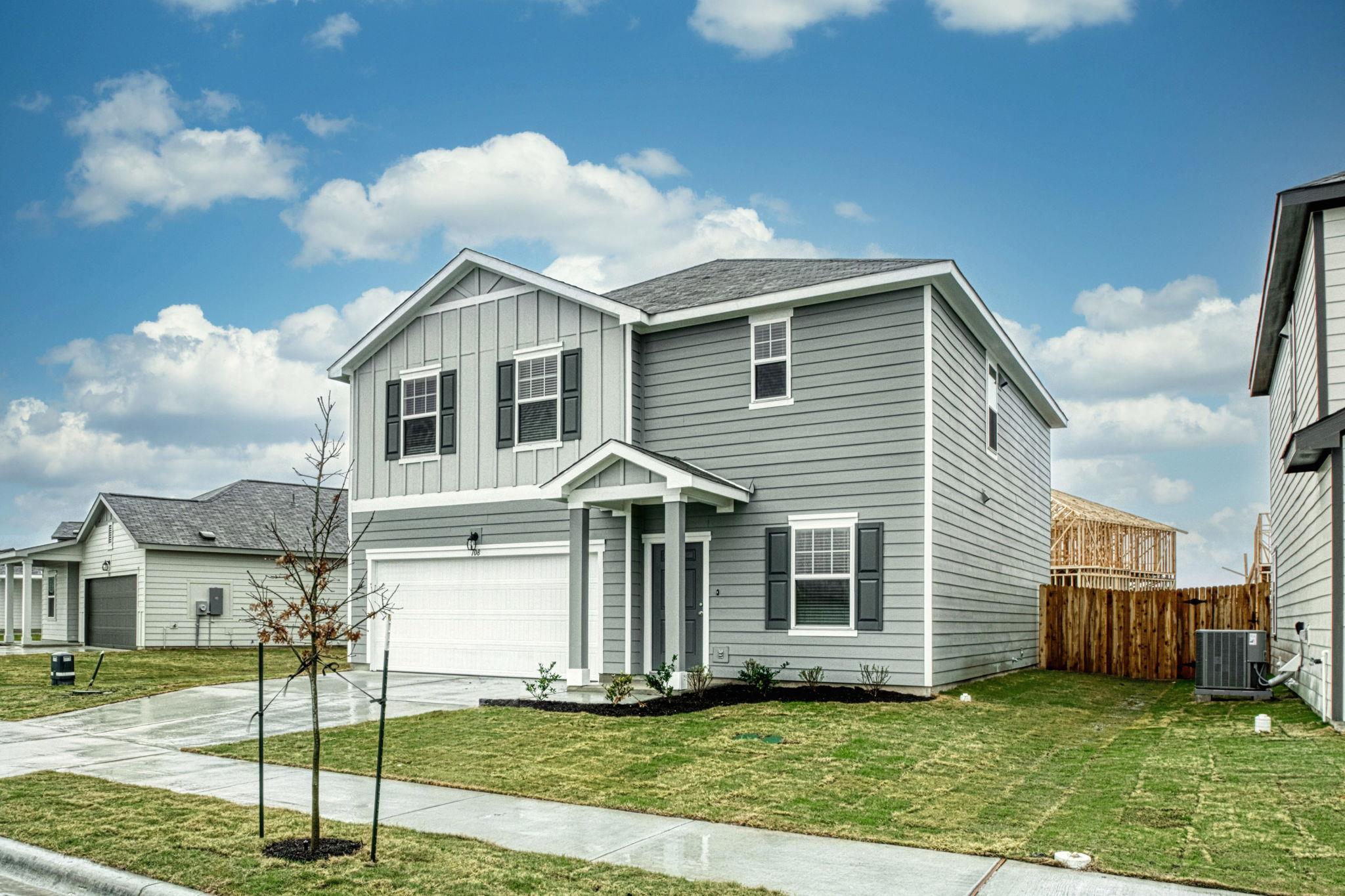 Crisp siding and a neat lawn frame this contempor