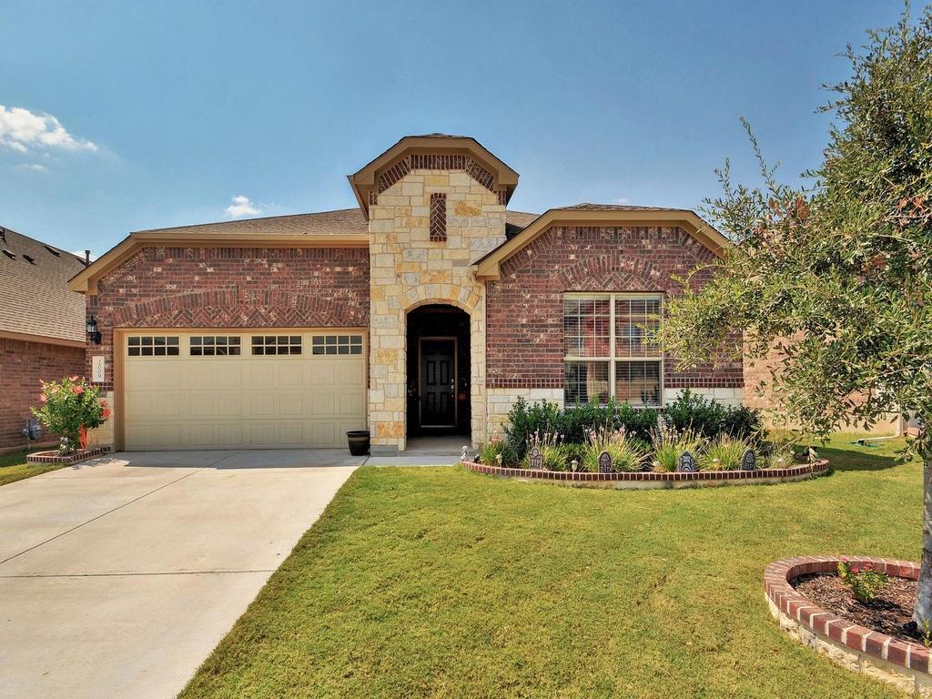 Classic brick and stone exterior elements create 