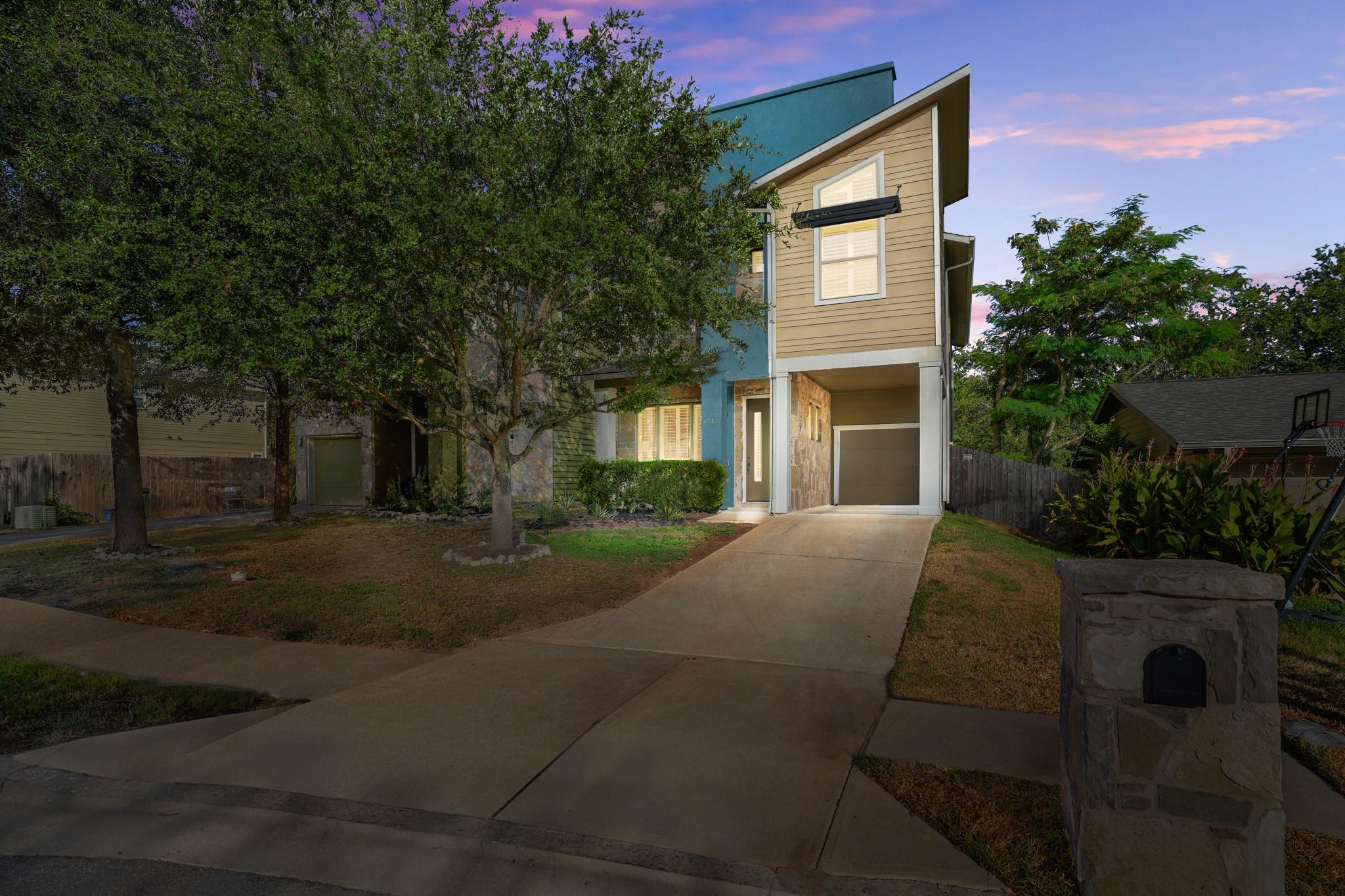Angled rooflines and mixed siding textures define
