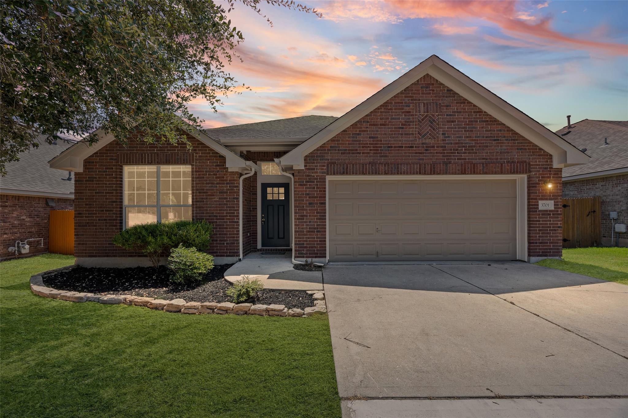 Classic brick elevation highlights this single-st