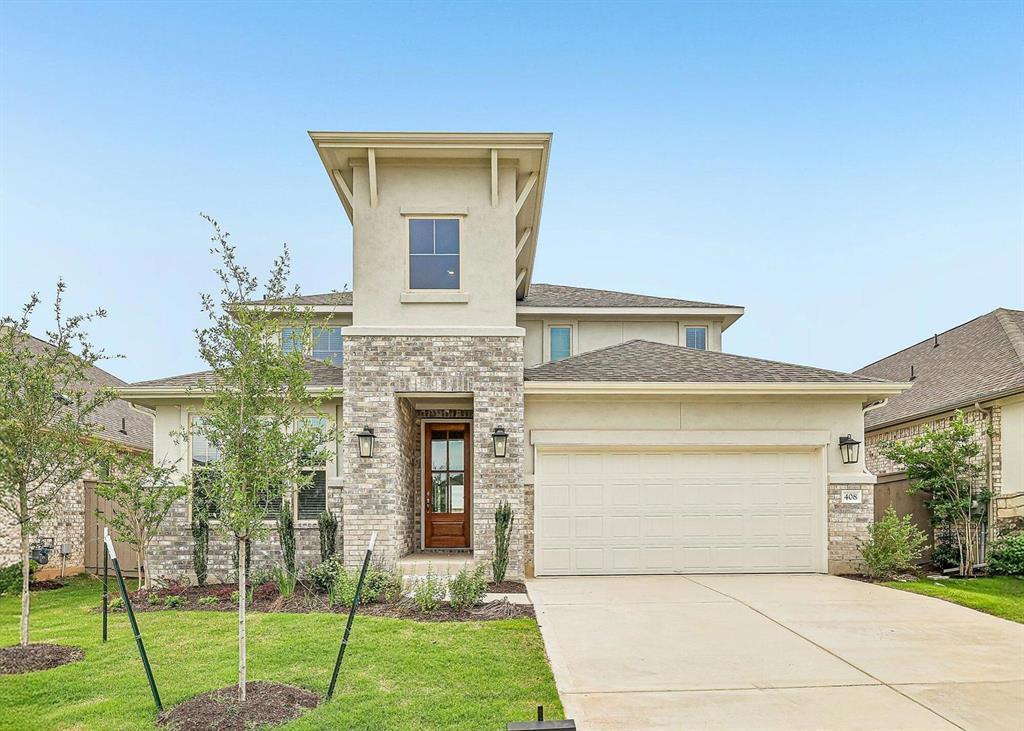 Natural stone and smooth stucco accents define th