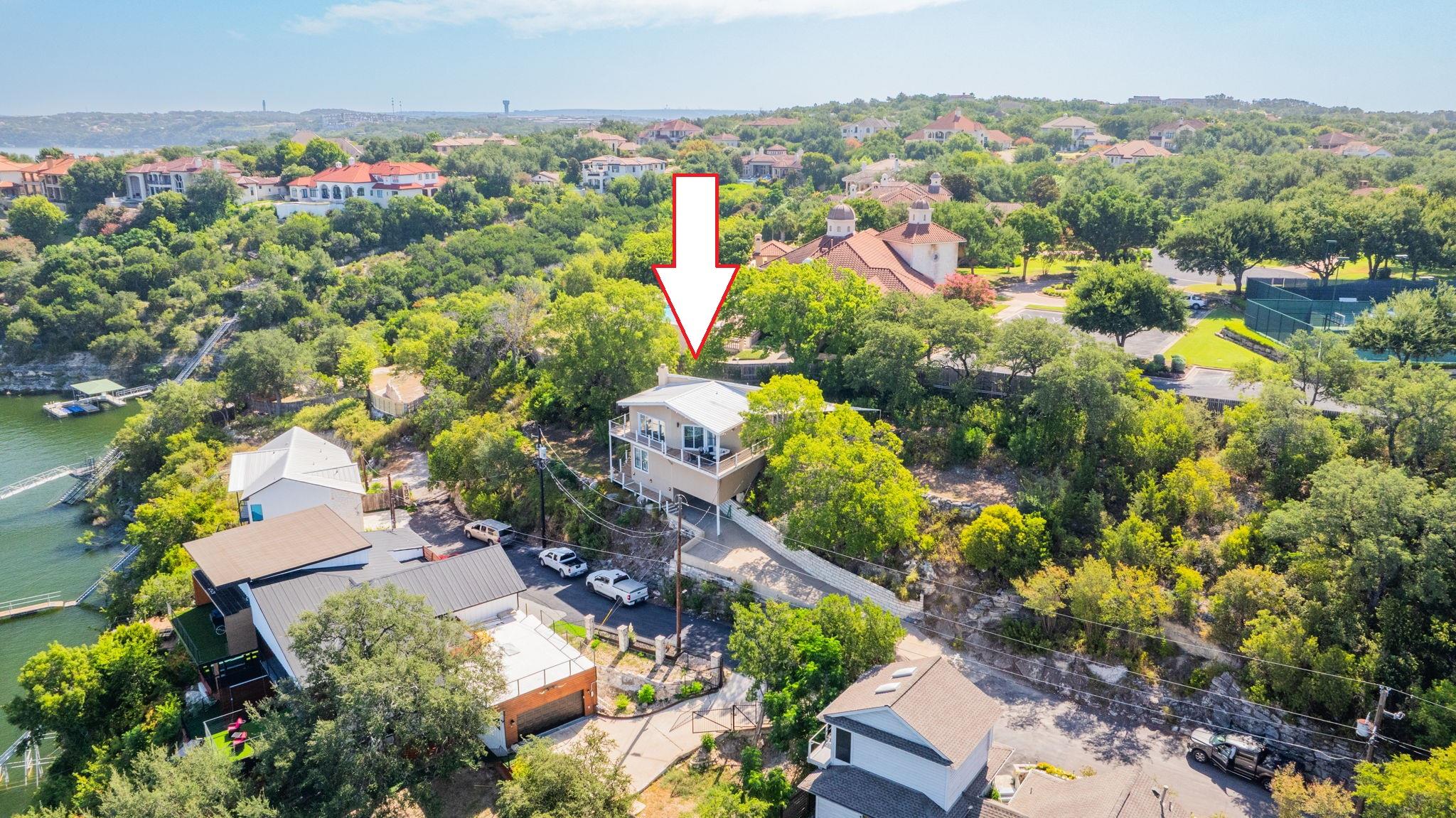 Elevated lakeside living defines this exceptional