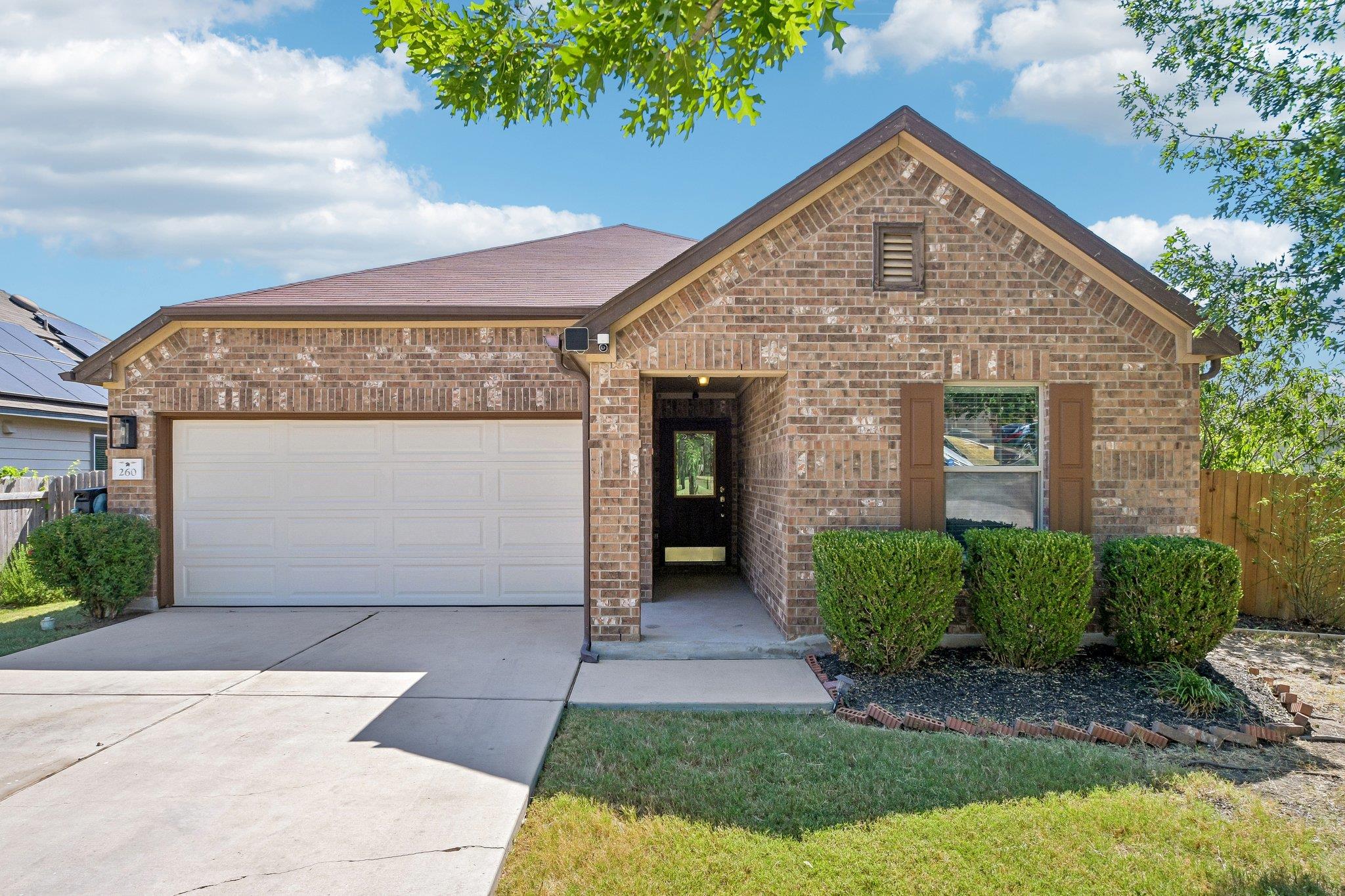 Classic brick exterior showcases an attached two-
