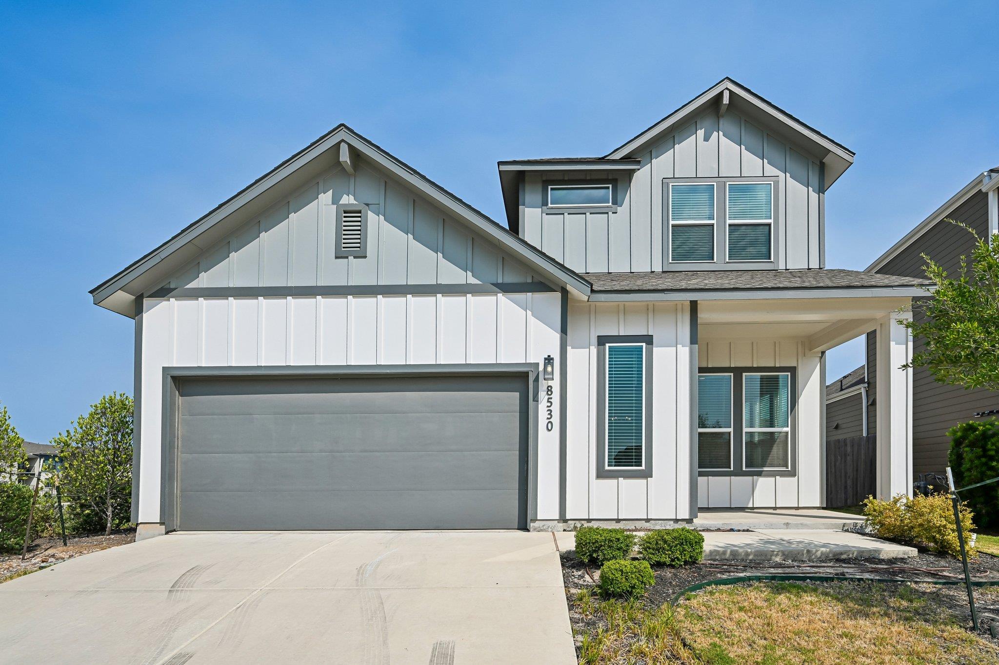 Board and batten siding meets a two-car garage un