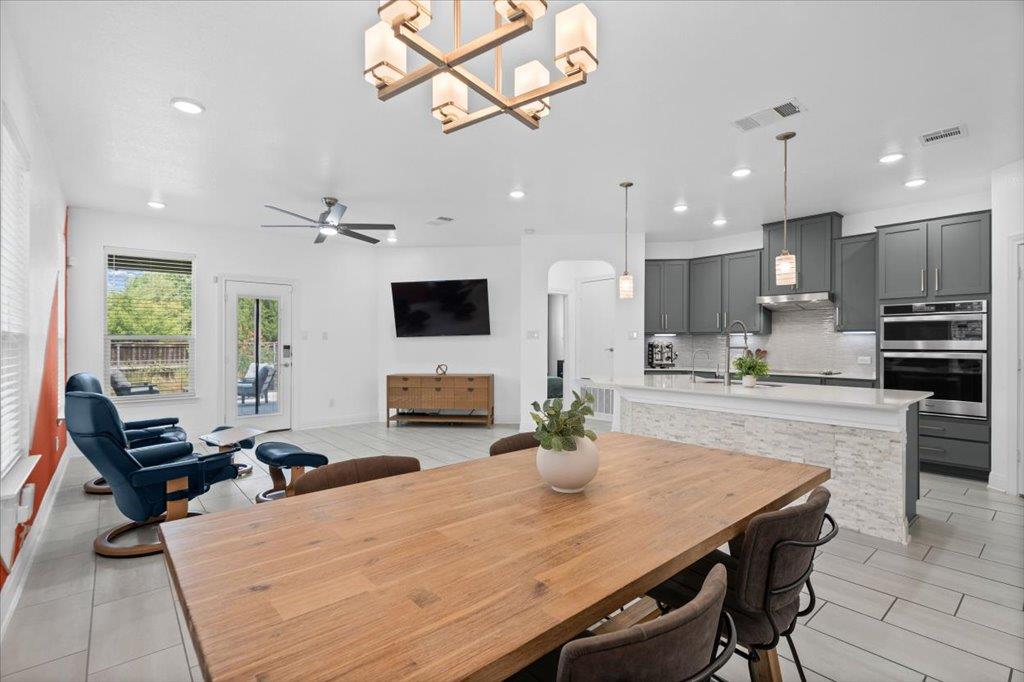 An open floorplan seamlessly connects the dining 