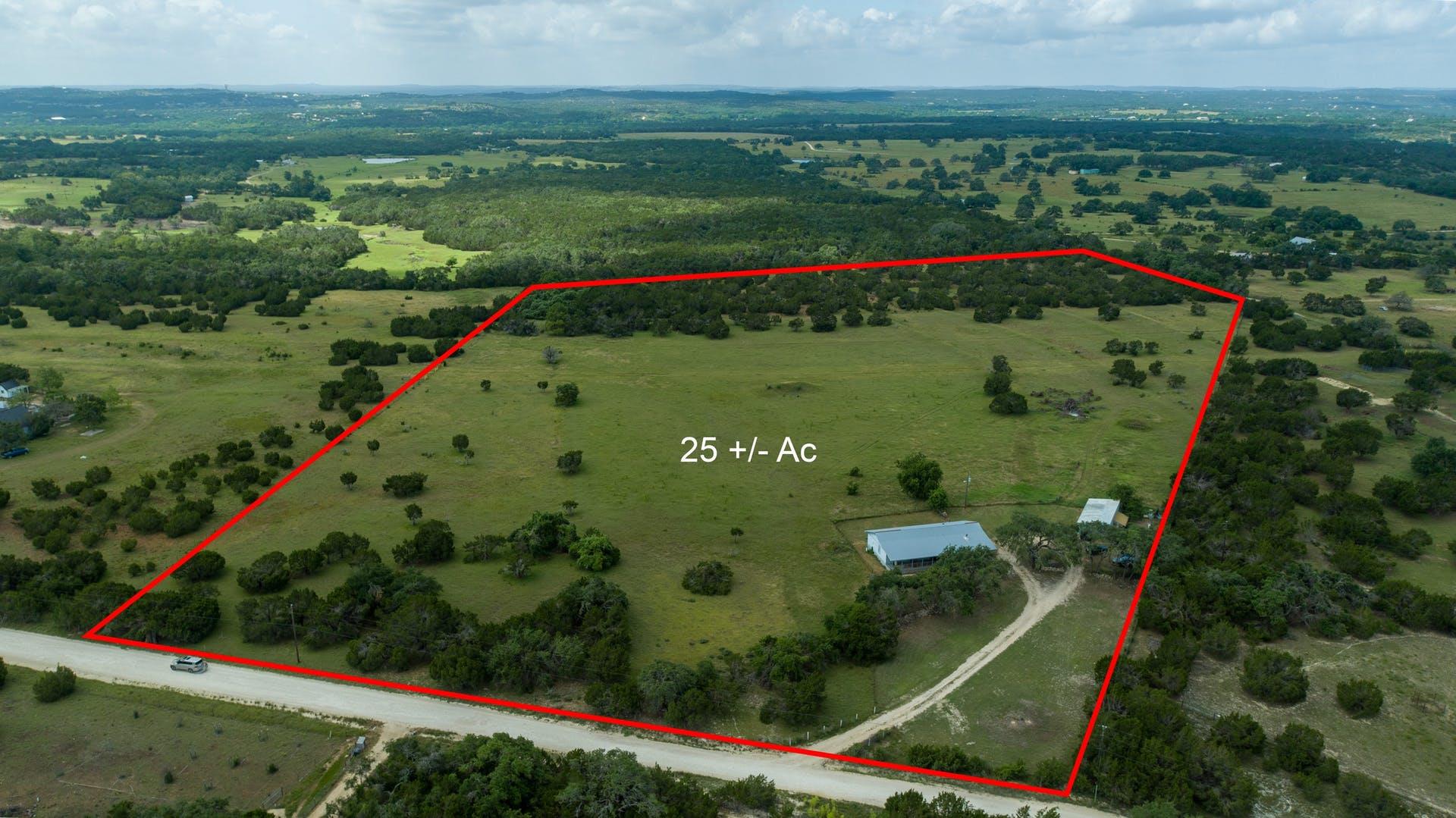 Rolling green pastures and mature trees define th