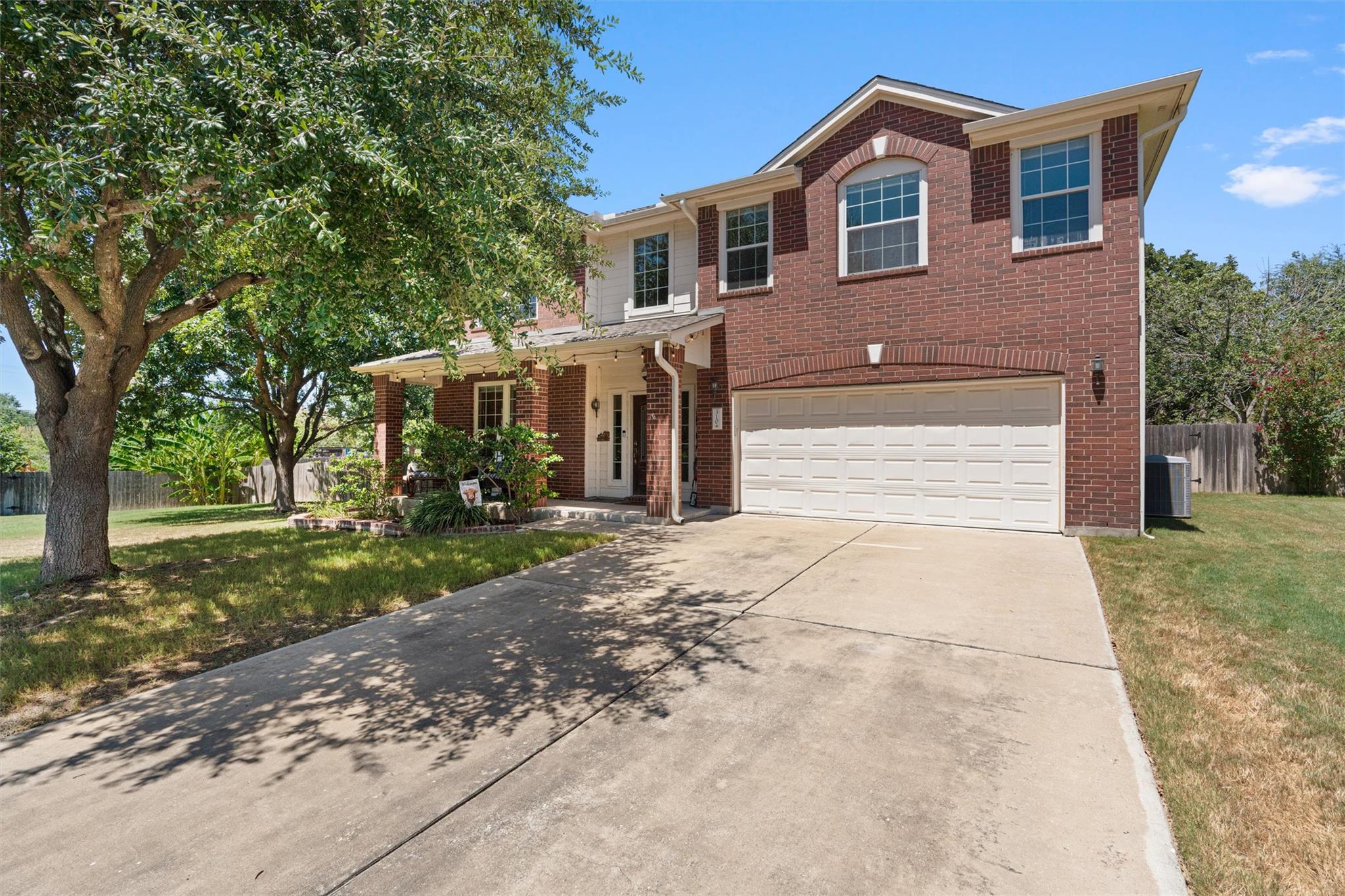 A spacious concrete driveway leads to the integra