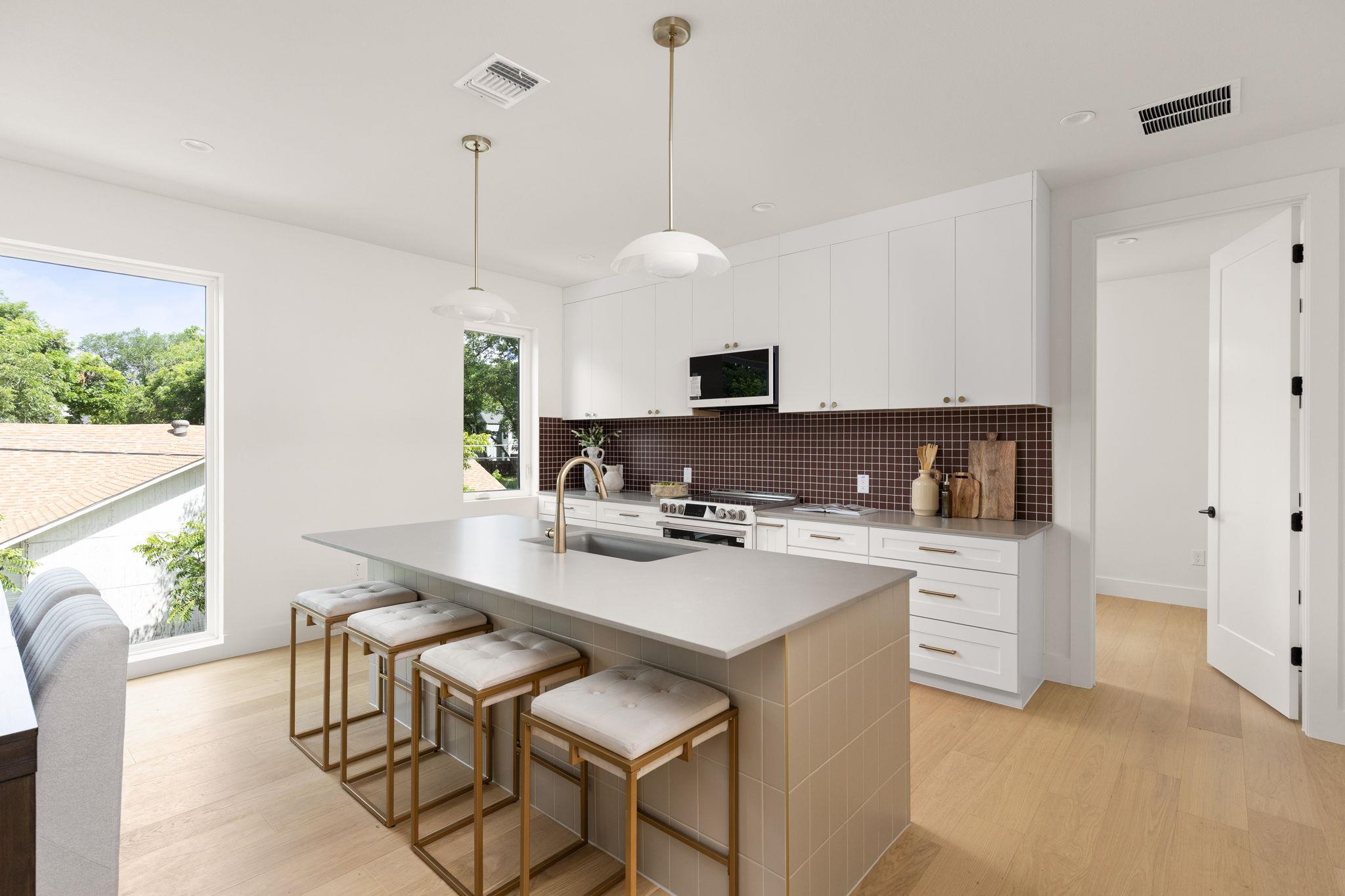 Clean lines and a spacious center island define t